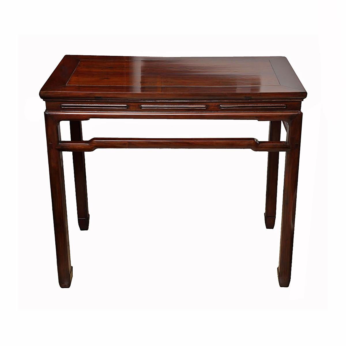 A Chinese mid-20th Century console or sofa table, with humpback stretchers and corner legs. Northern Elm wood (Jamu). A fine example of traditional Asian furniture craftsmanship, where no nails or screws are used, but a complex wood joint system.