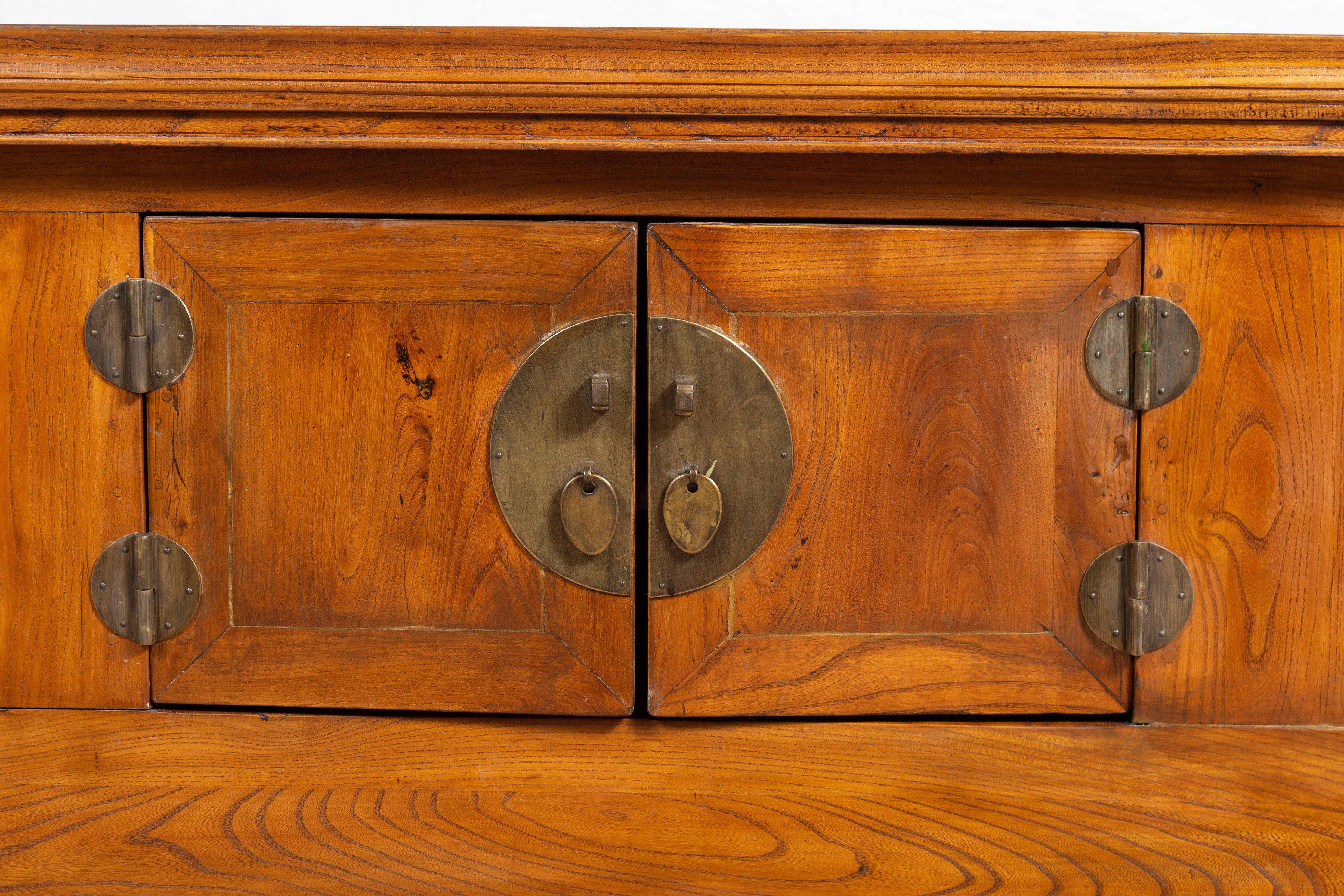 19th Century Chinese Elmwood Two-Door Low Kang Cabinet with Everted Flanges and Scrolls For Sale