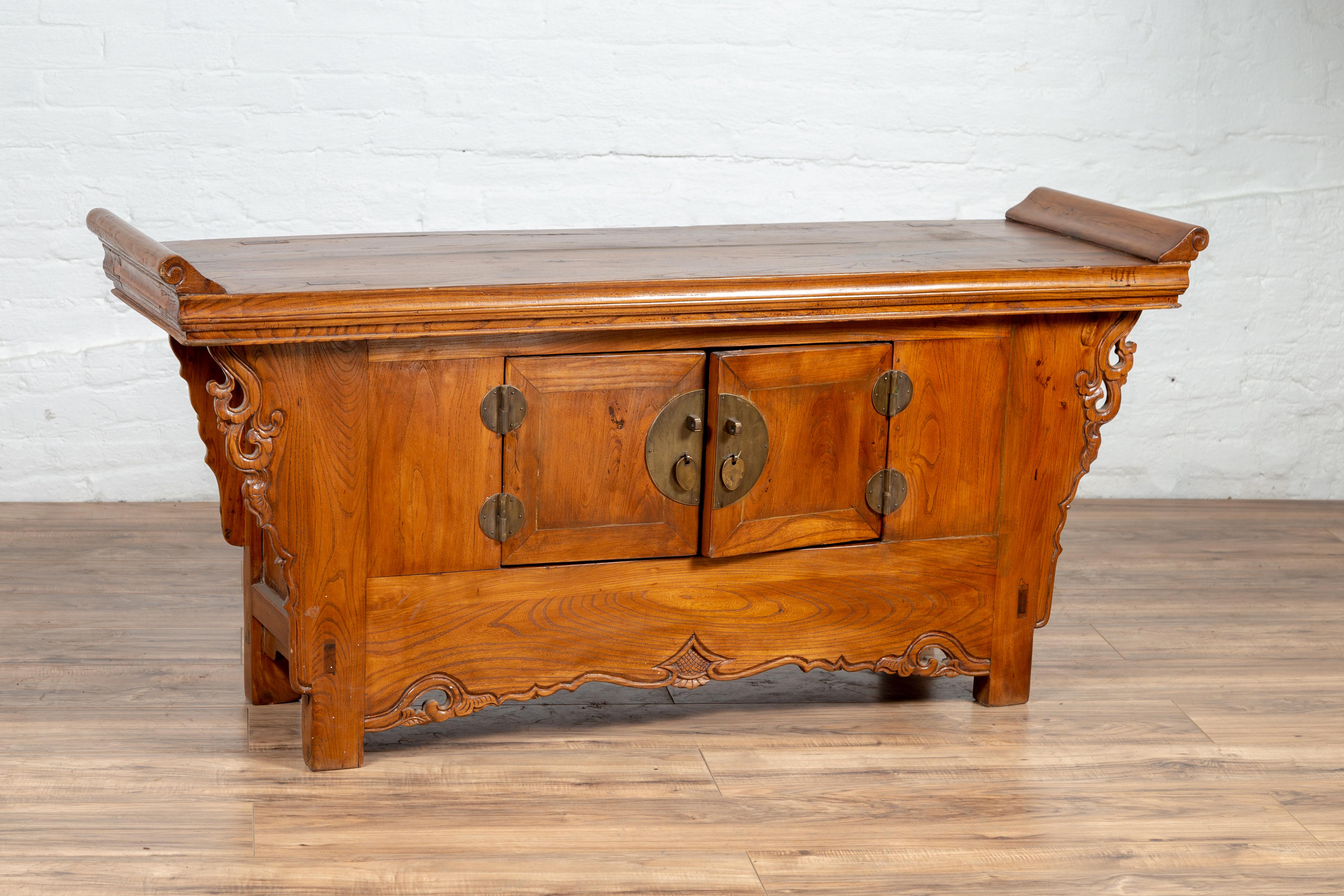 Chinese Qing Dynasty Elmwood Two-Door Low Kang Cabinet with Everted Flanges and Scrolls For Sale