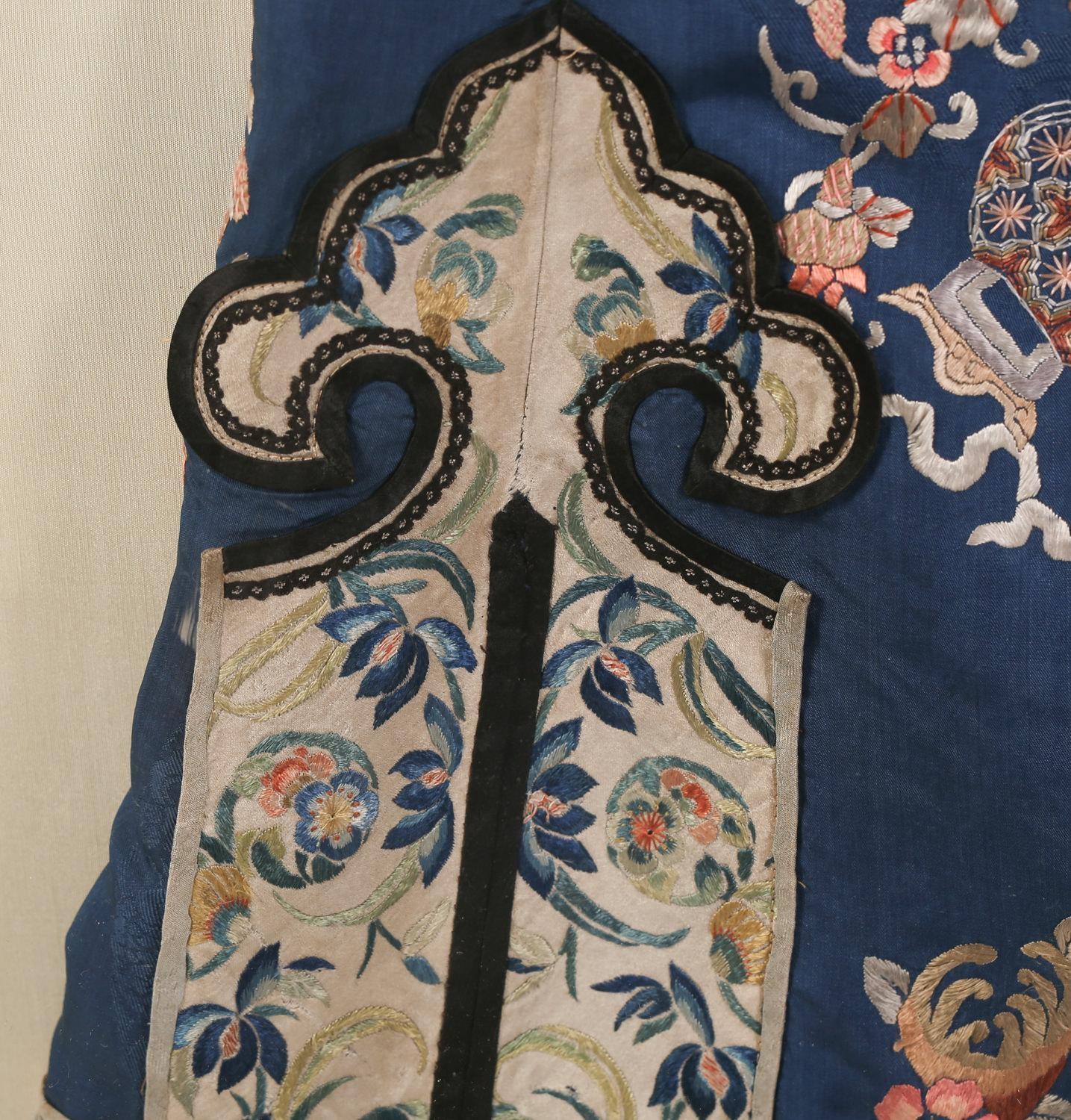 Chinese embroidered blue silk robe in a plexiglass box, Qing dynasty. Late 19th century, beautifully custom framed in Plexy glass frame to keep it in excellent condition, from an important Palm Beach collection.
Measures: Length 40 1/2 inches, the
