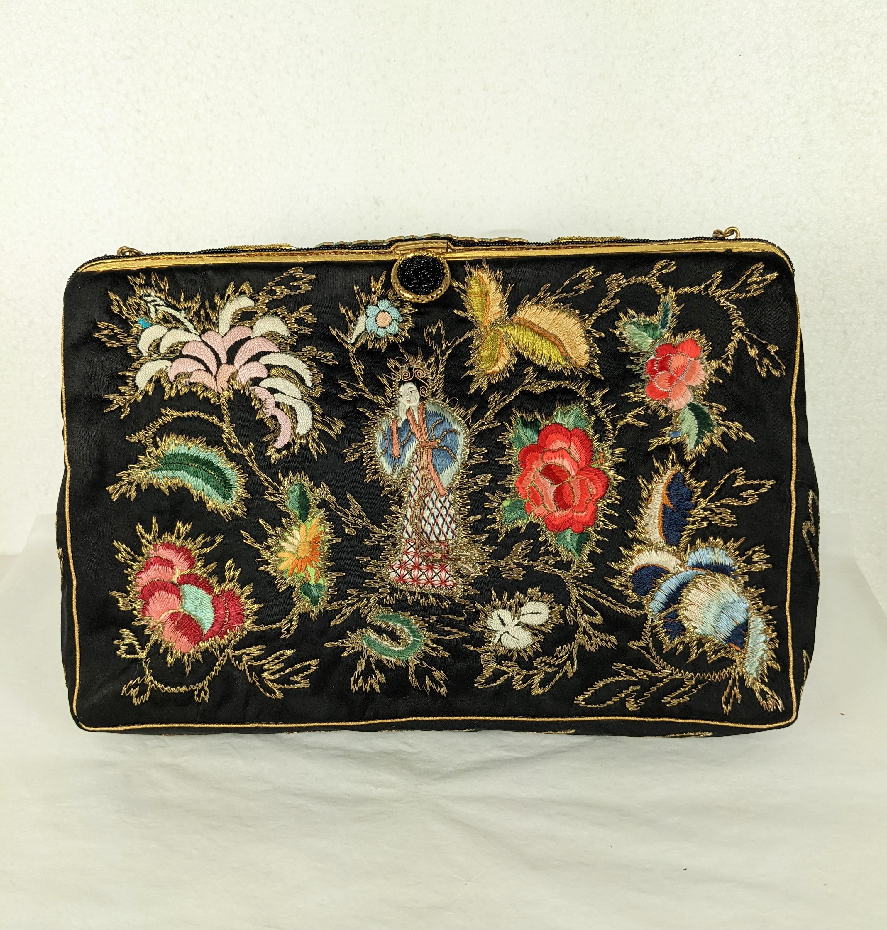 Elegant Chinese Embroidered Evening Bag mounted in the UK. Lovely antique silk satin textile finely embroidered with figures and metallic lame thread accents. Enamel decorated and glass beaded frame. 1950's, Mounted in the UK.  
9.5