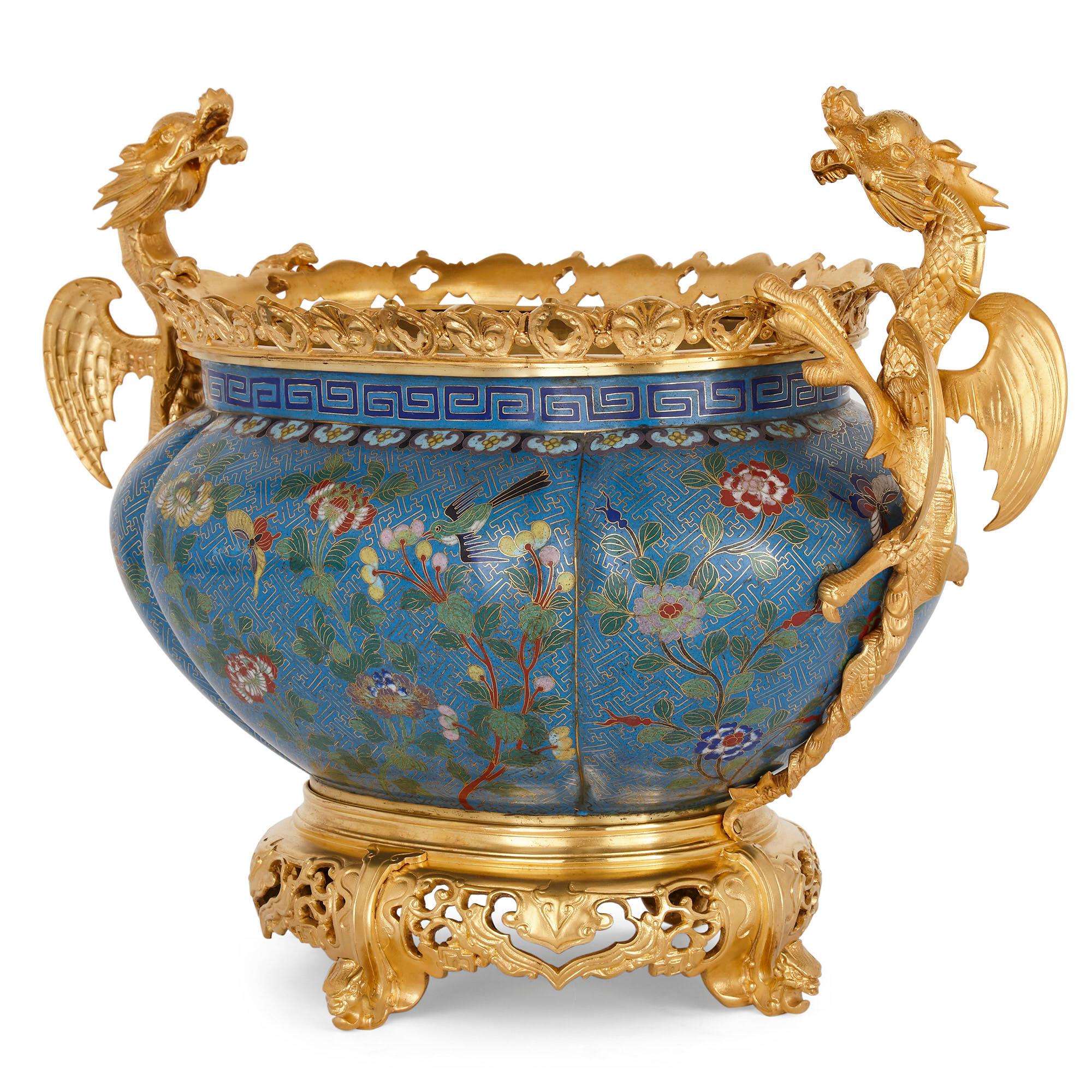 Chinese enamel and French gilt bronze Chinoiserie jardinière
The enamel Chinese and the gilt bronze French, 19th century
Measures: Height 40cm, width 53cm, depth 30cm.

This Chinoiserie style jardinière features a beautiful cloisonné enamel