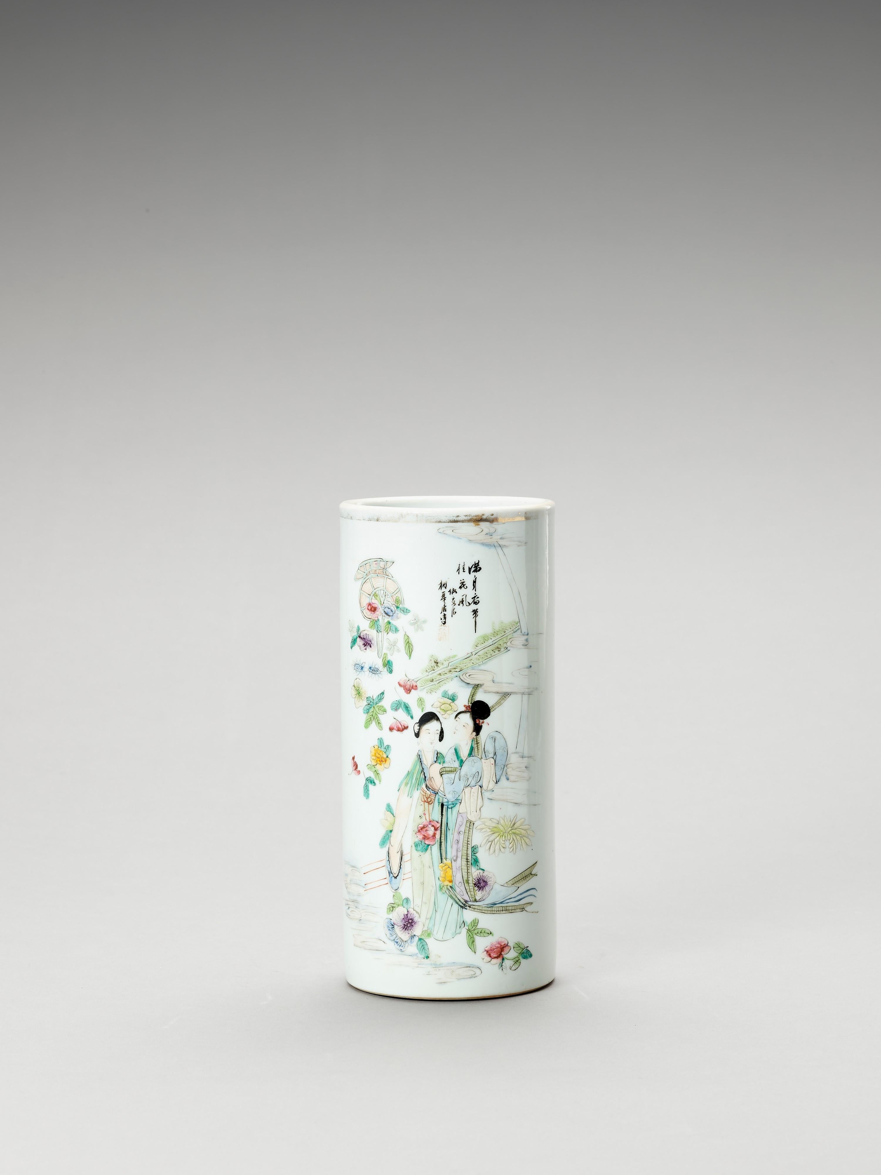 Chinese Enameled Cylindrical porcelain vase, 1900-1920

The tall, cylindrical vase is delicately painted with polychrome enamels showing two court ladies in a garden landscape as well as calligraphy and an artist signature. Apocryphal