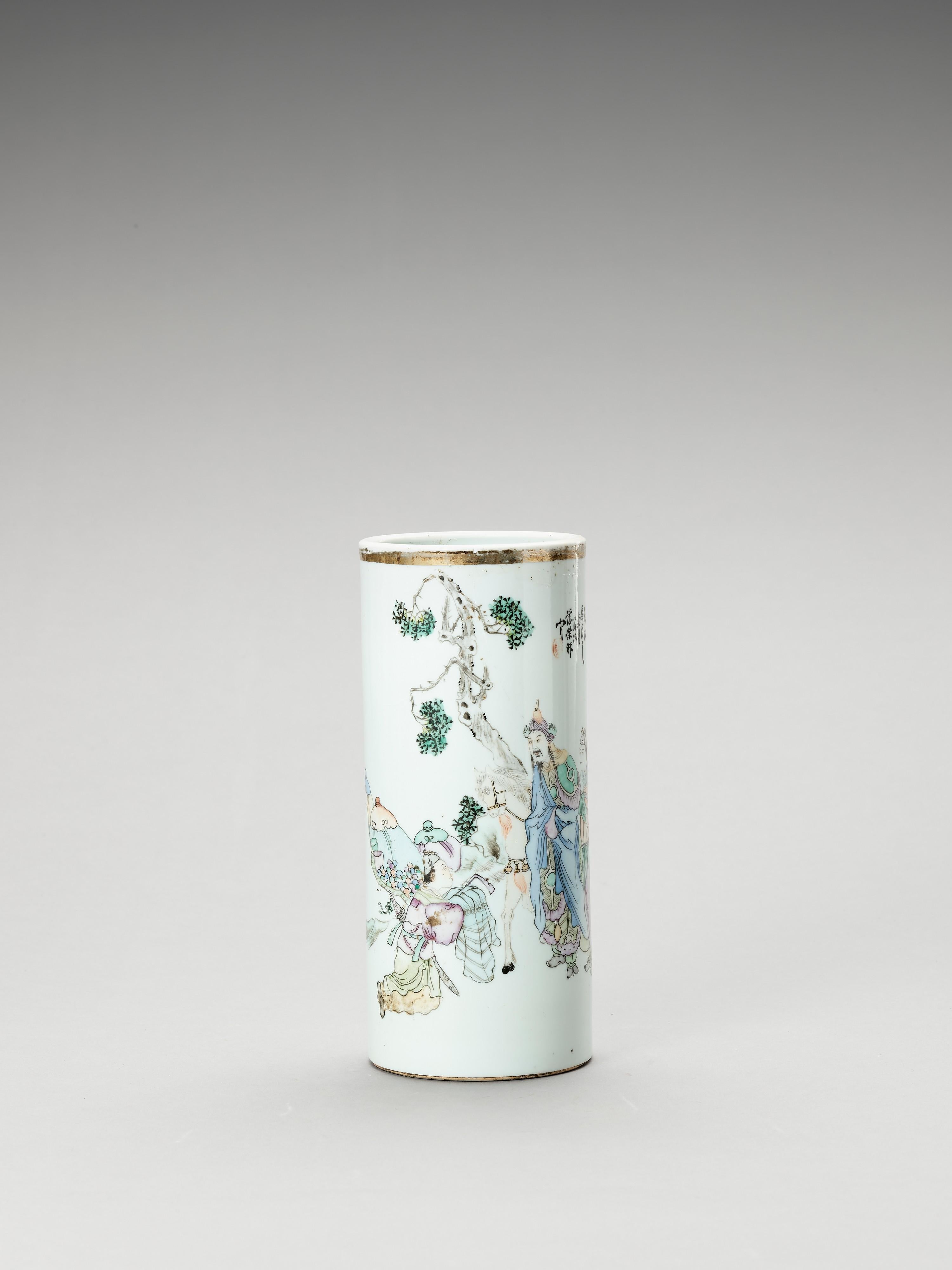 Chinese Enameled Cylindrical Porcelain vase, Late Qing to Republic Period, 1900-1950

The tall, cylindrical vase is painted with polychrome enamels showing a dignitary on horseback with a servant below a pine tree, to its left, a pile of treasure