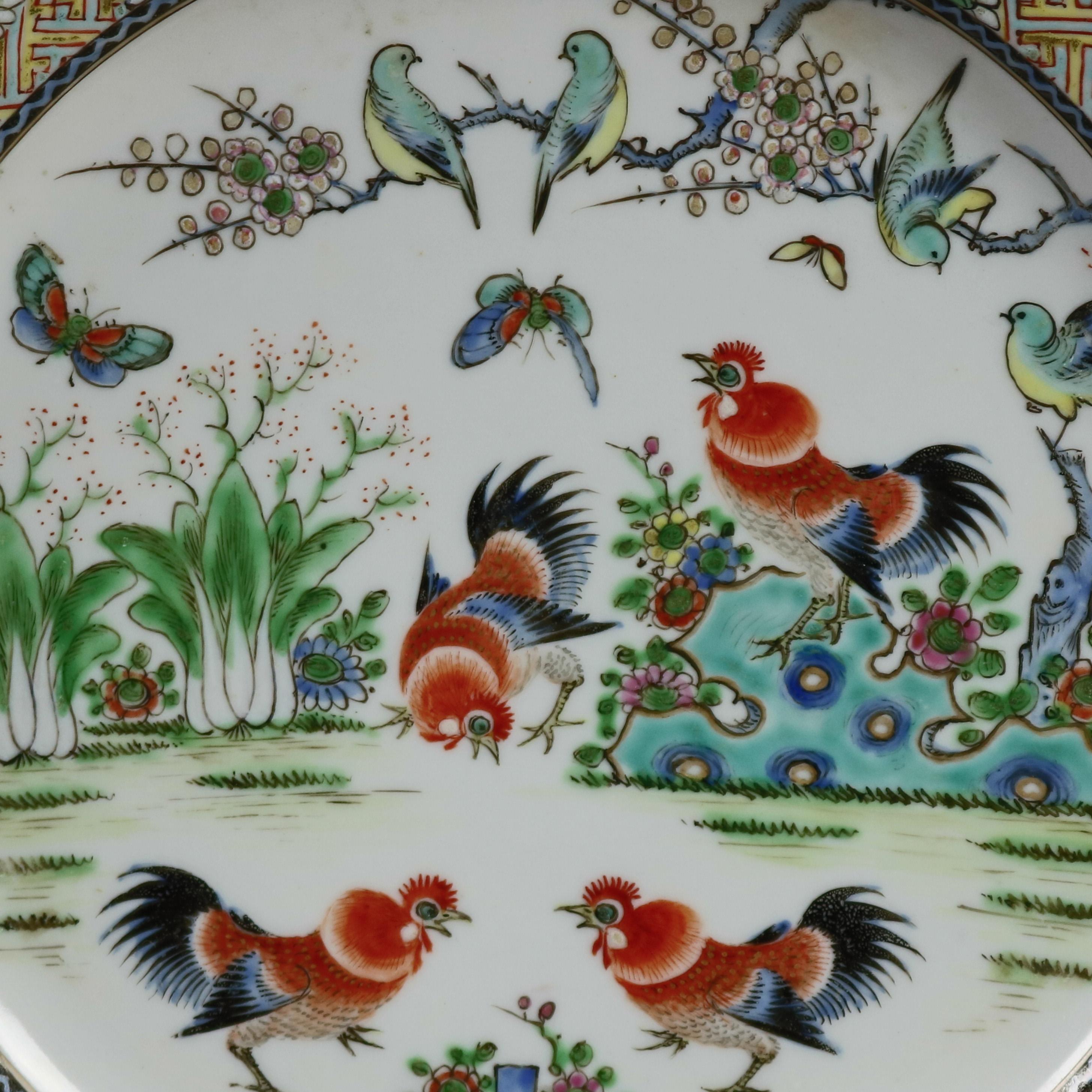 A pair of Chinese hand enameled pictorial plates offer central garden scene with roosters, birds and butterflies, rim having basket weave border with foliate reserves, 19th century

***DELIVERY NOTICE – Due to COVID-19 we are employing NO-CONTACT