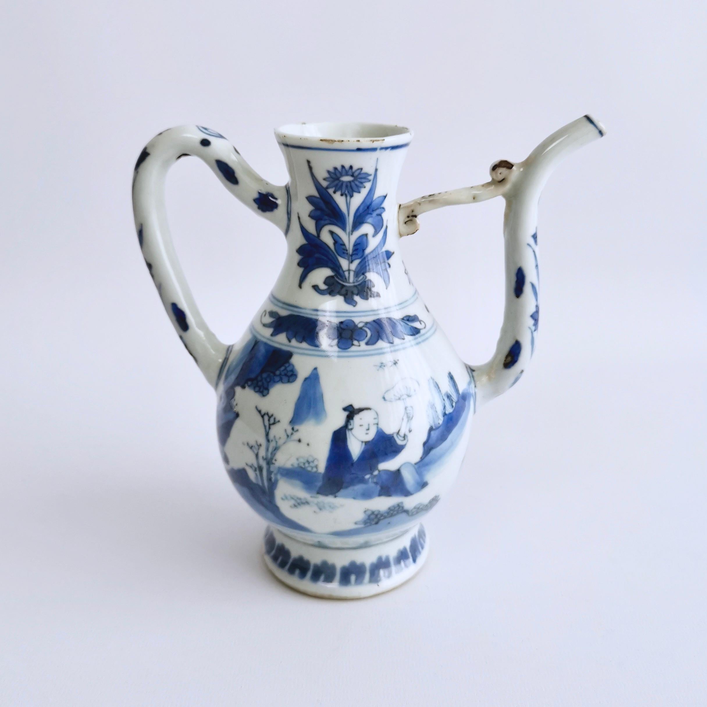 On offer is a beautiful ewer from the Chongzhen Transitional era, roughly between 1628 and 1644. The ewer has a beautiful underglaze blue painting of reclining figures fanning themselves.

The Chongzhen Emperor was the 17th and last Emperor of the