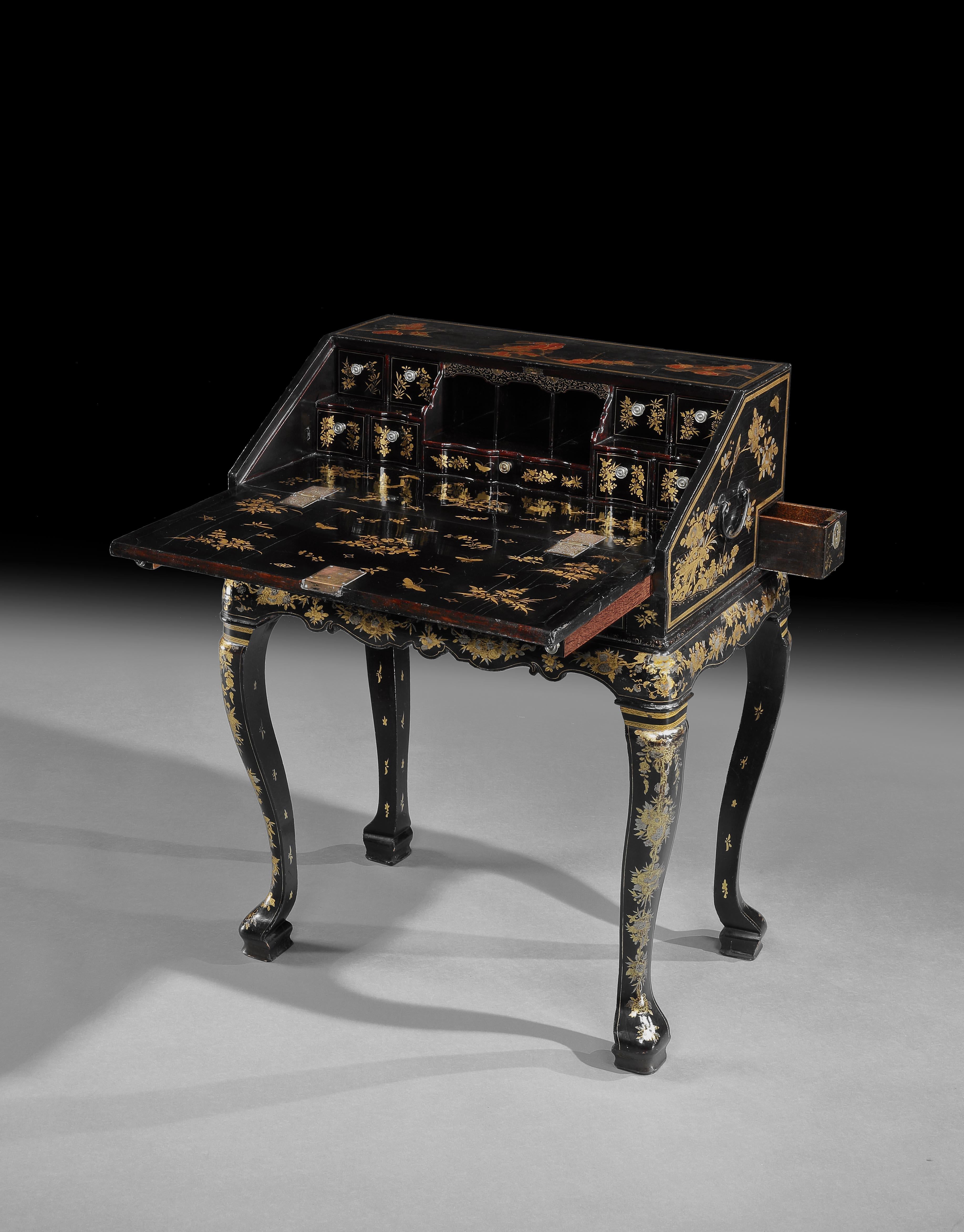 A fine and rare mid 18th century Chinese Export lacquer bureau on stand. Probably made in Canton specifically for the export trade to meet the demands of the European market. Beautifully decorated throughout with gilded decorations on a black