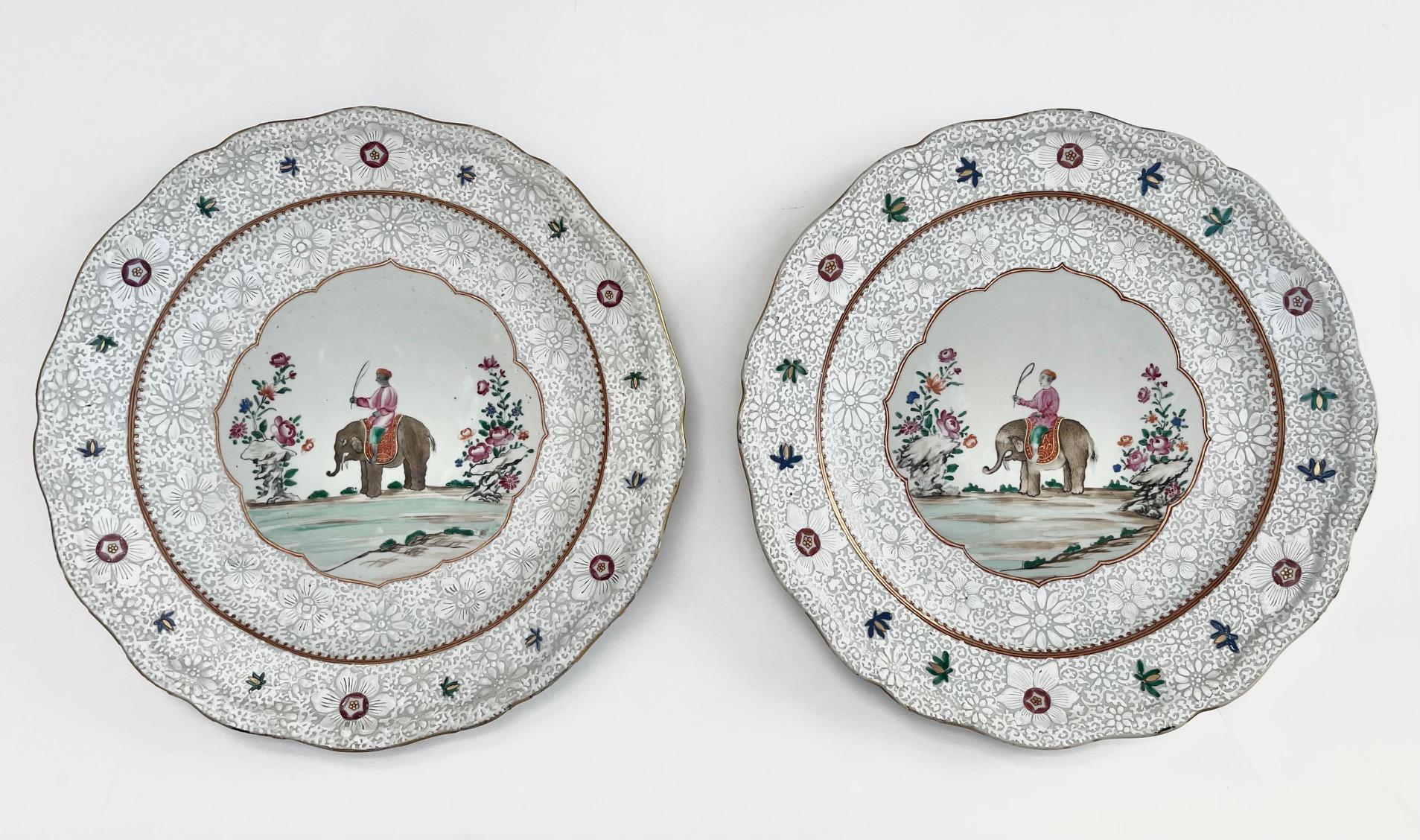 A very fine and exceptionally rare pair of circa 1760 Qianlong period Chinese export for the Anglo-Indian market chargers of large size, the molded and scallop-shaped bodies painted with delicately enameled 'bianco-sopra-bianco' floral borders with
