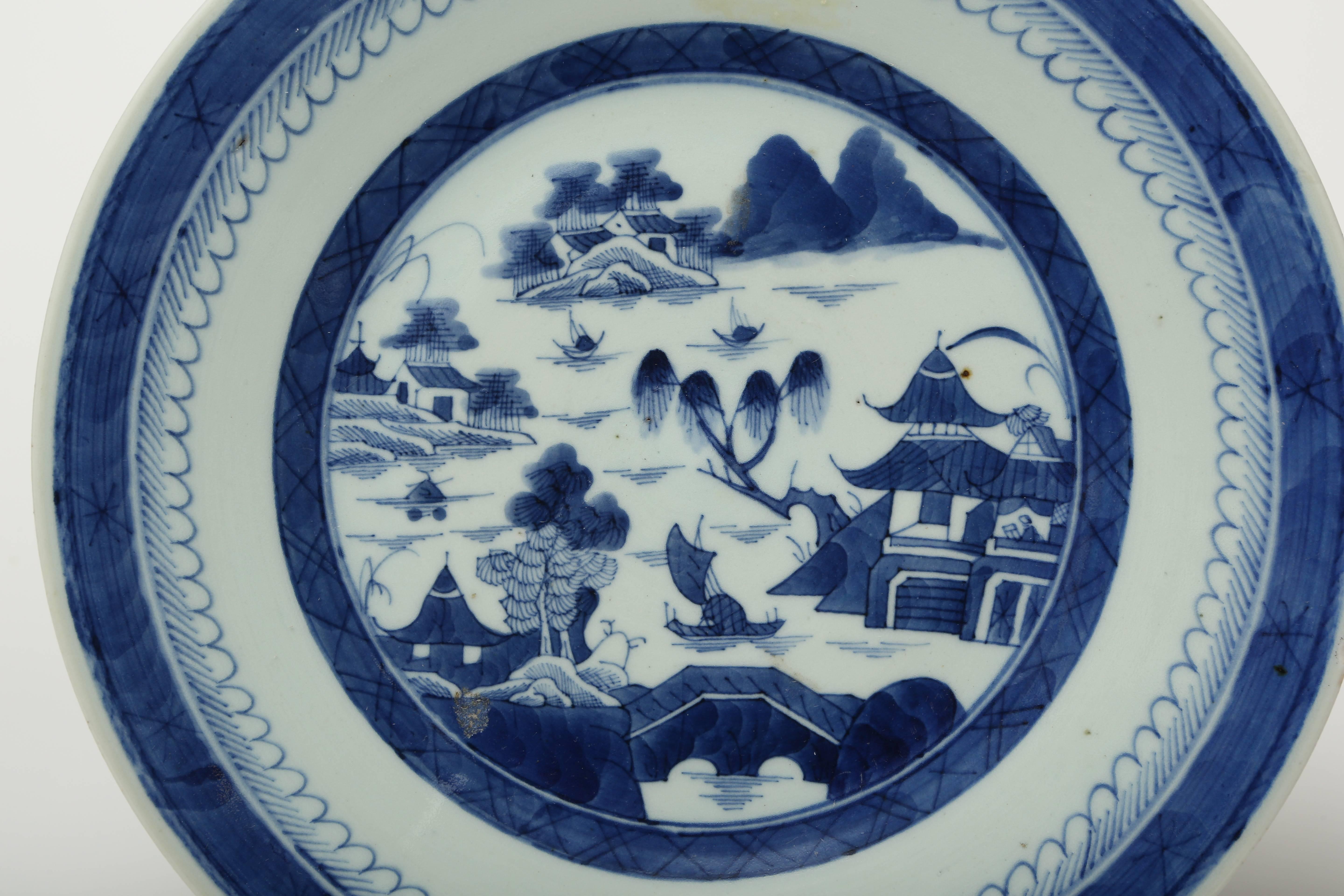 Chinese export charger hand decorated in underglaze blue.  Lovely hand painted detail on the reverse.
Small edge flake typical of pieces from this period.
 