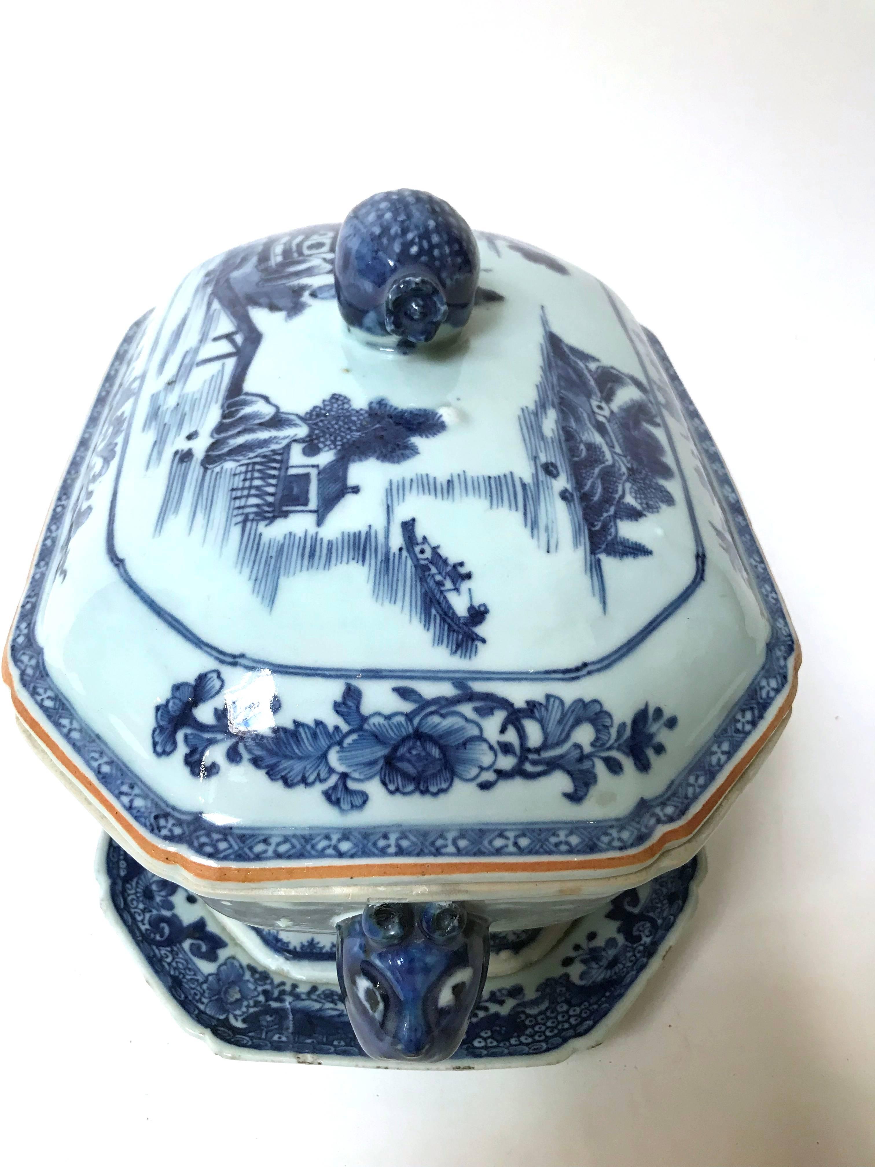 Chinese export blue and white tureen with cover and underplate (tureen base has restorations) circa 1790–1820, the tureen of slab construction and stoutly potted, an elongated octagonal plan, having a conforming flared foot and boars head handles,
