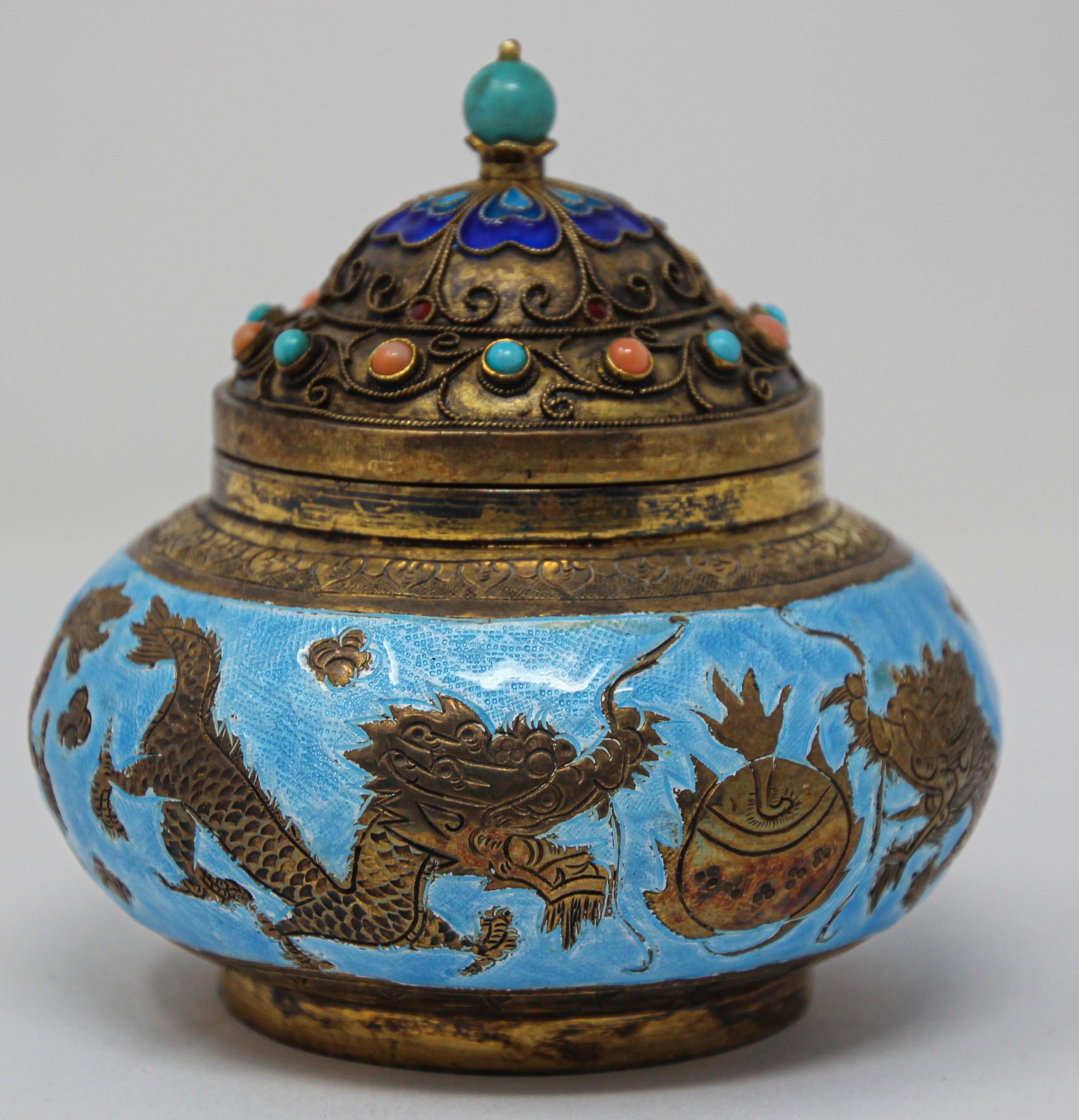 Asian Chinese export snuff or censor box hand painted with gold dragons on turquoise blue enamel background the top cover is enameled and inlaid with semi precious turquoise and coral stones.
Chinese brass and enamel tea or opium, snuff lidded box