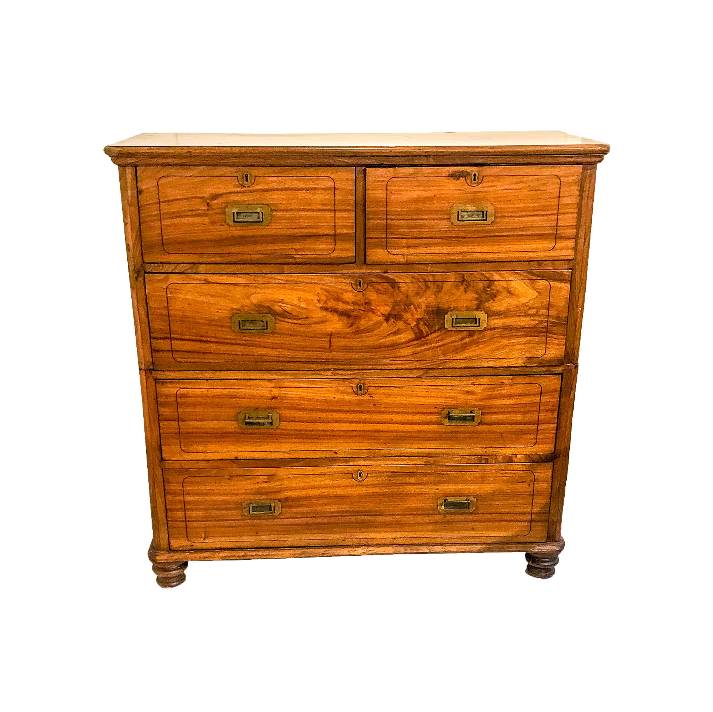 With beautiful grain in two parts with two small top drawers over three long drawers,
Each drawer front has ebony string inlay. The edges are rounded with a thumb molded top

And base, original turned feet and all the brasses, circa