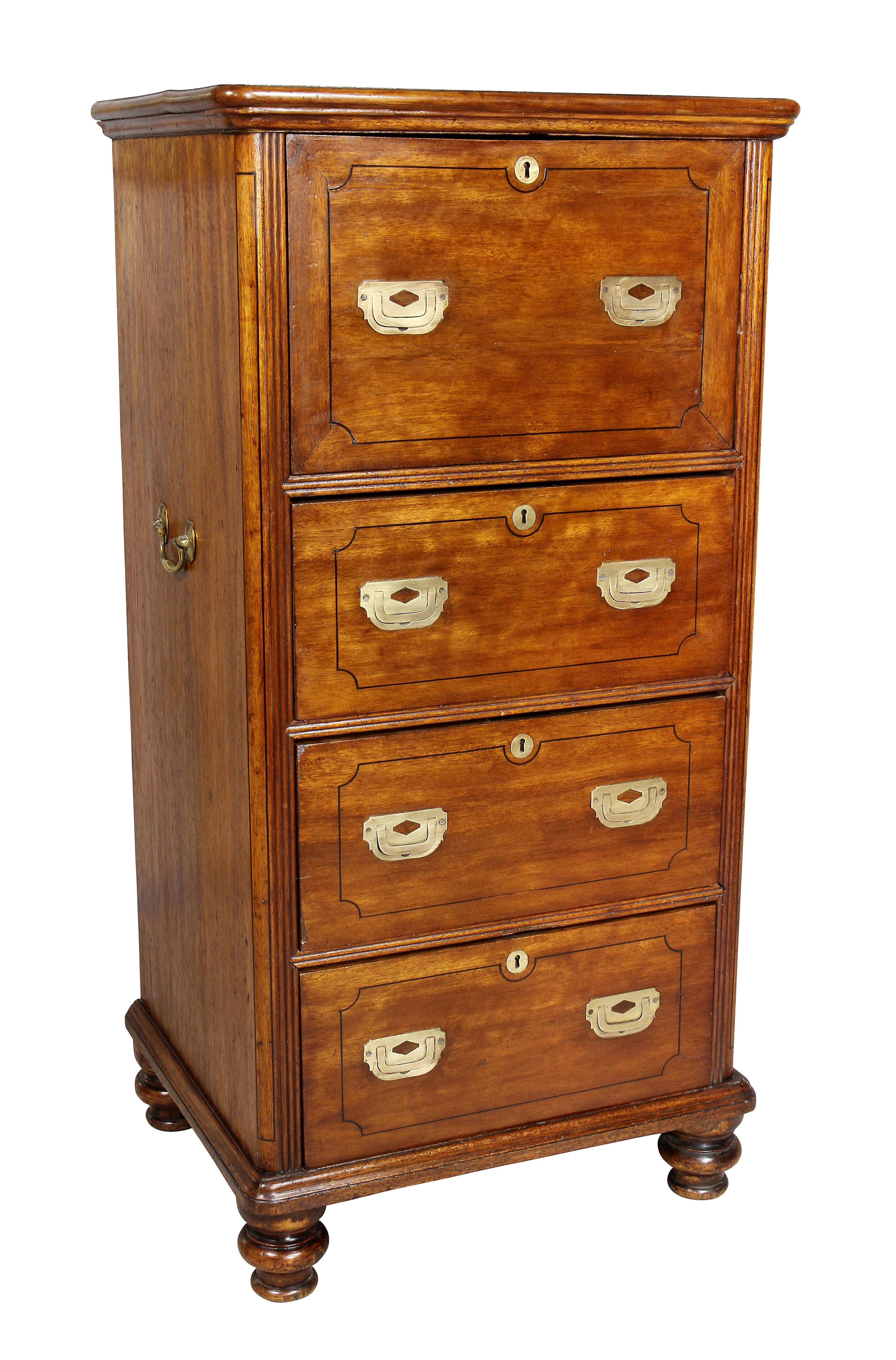 Unusual proportions with rectangular top and molded edge over a fold down desk over three drawers, turned toupie feet.