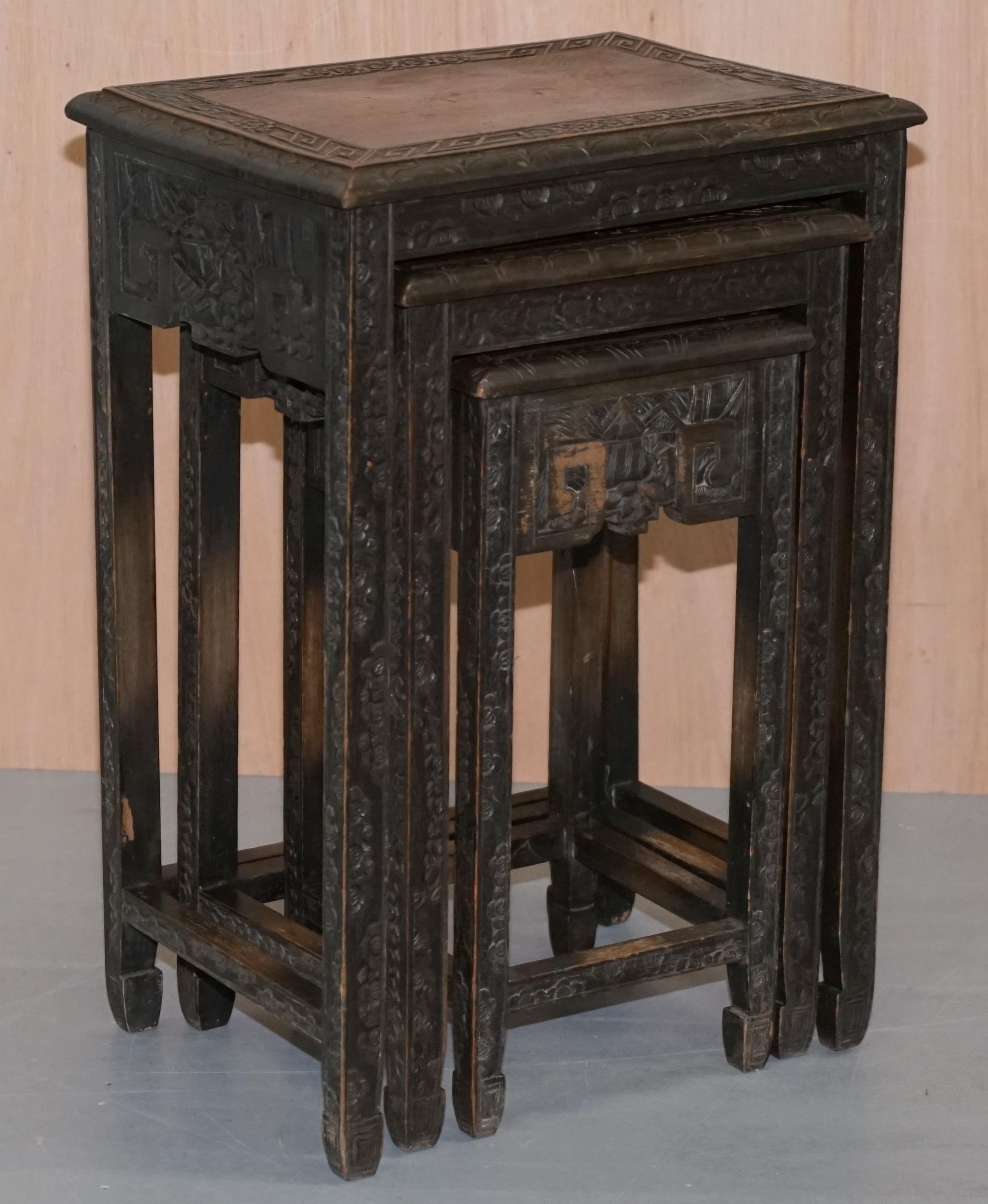 we are delighted to offer for sale this lovely set of circa 1900 ebonized Chinese Export nested tables all heavily carved

A very good looking suite, these are heavily carved with rural scenes, floral detailing and Aztec type lines all-over, the