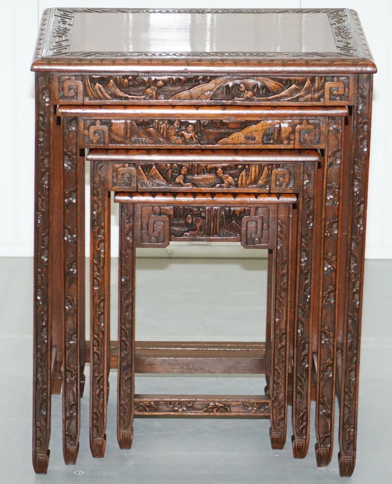 Hand-Crafted Chinese Export circa 1930s Nest of Four Tables Heavily Carved All over in Teak