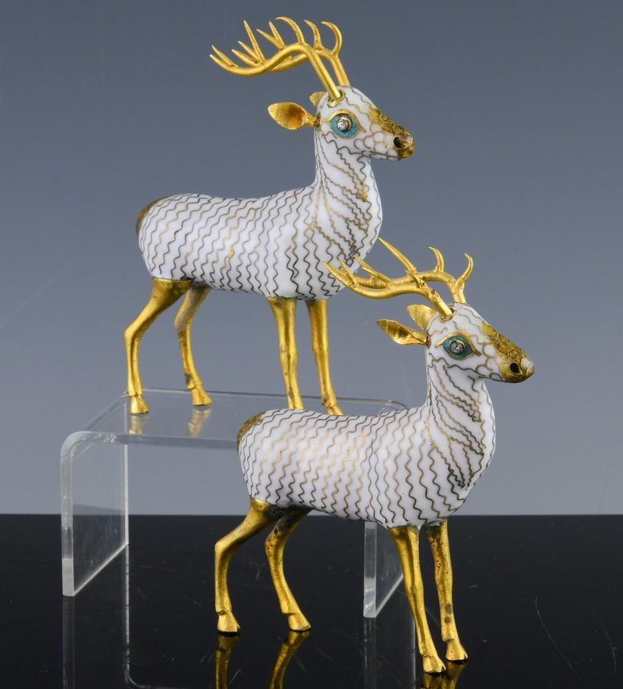 Chinese Export Cloisonne figures of stags,
Early 20th century,

Wonderful, expressive pair of small cloisonne models of stags with gilt horns and legs and a gold and white body.

Dimensions: 4 inches tall by 4 inches long x 1 inch deep.

    