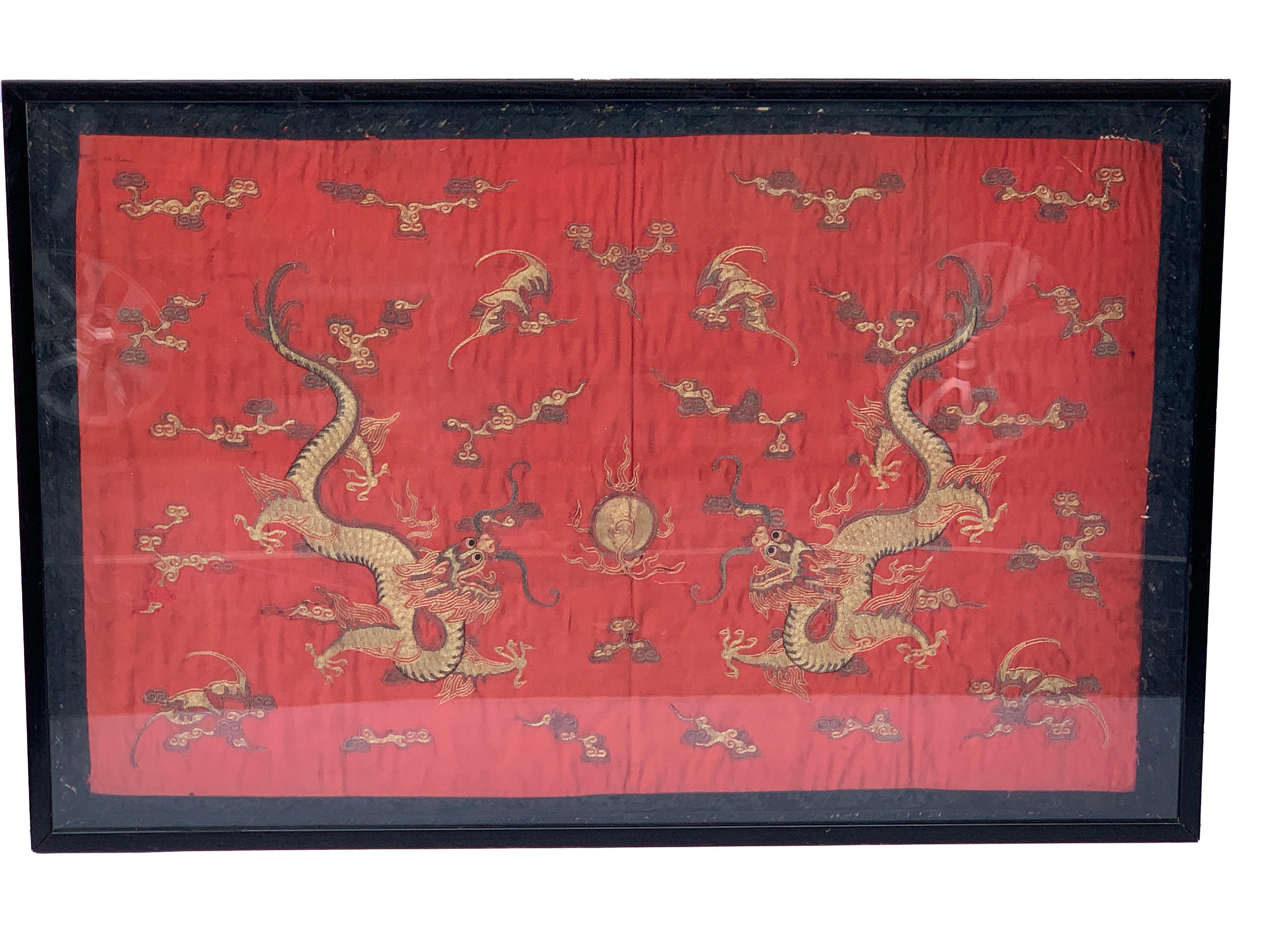 Chinese red silk dragon embroidery, with red background two floating central dragons.
Measures: Silk 36
