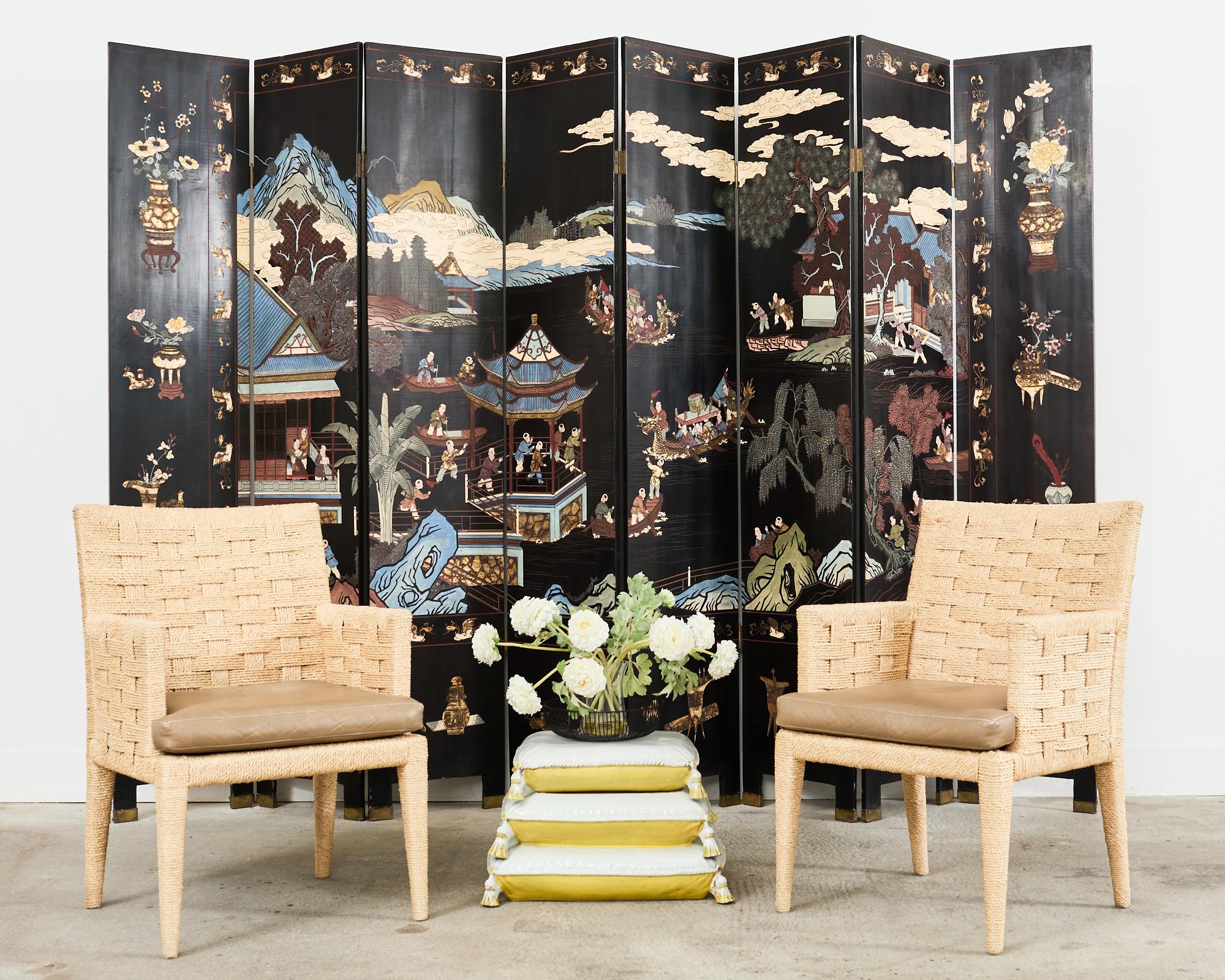 Spectacular Chinese export eight-panel coromandel screen featuring a vibrant blue mountain landscape with pavilions and pagodas. The idyllic screen has a fertility theme decorated with numerous young boys engaged at leisurely activities amid trees