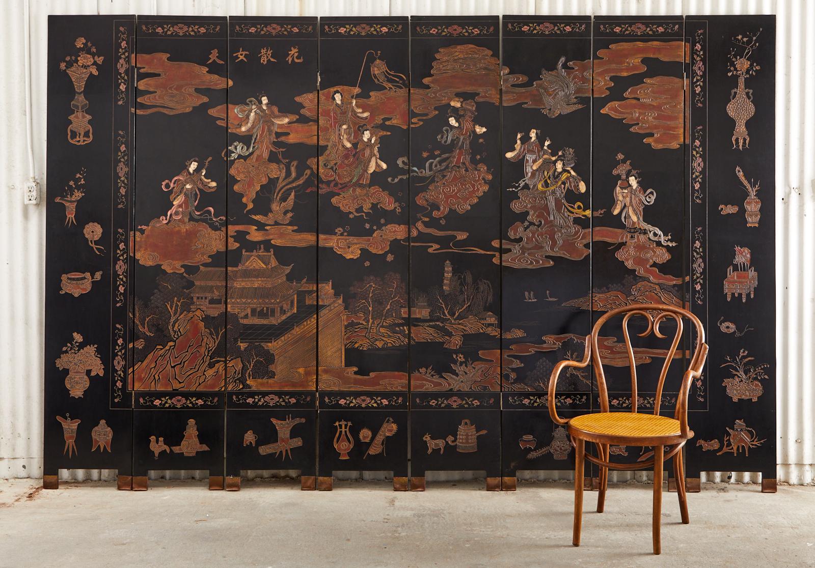 Divine Chinese export eight-panel coromandel screen depicting the Chinese mythological daoist character Xiwangmu and her heavenly entourage. Beautifully detailed with flowing robes and stylized clouds on the main scene. Bordered by scholars objects