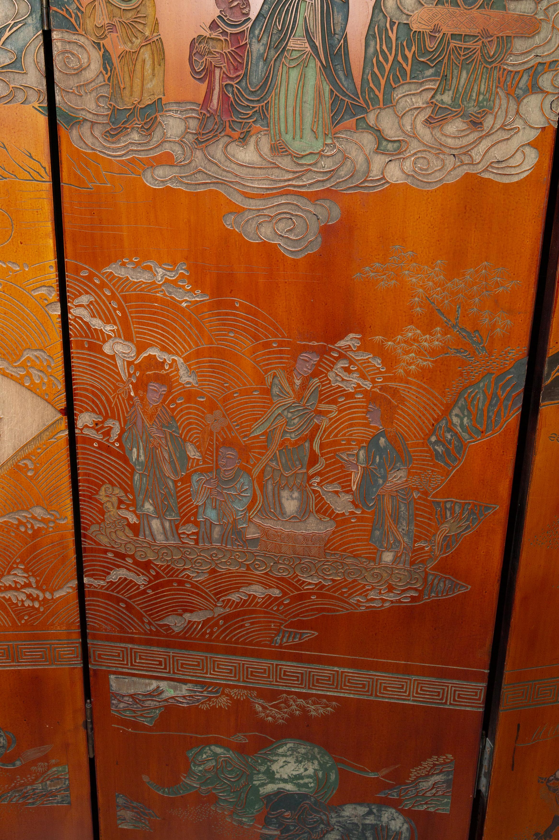 This is a lovely Chinese export hand painted screen, with an unusual sienna back ground, carved and painted overall with figures and animals.