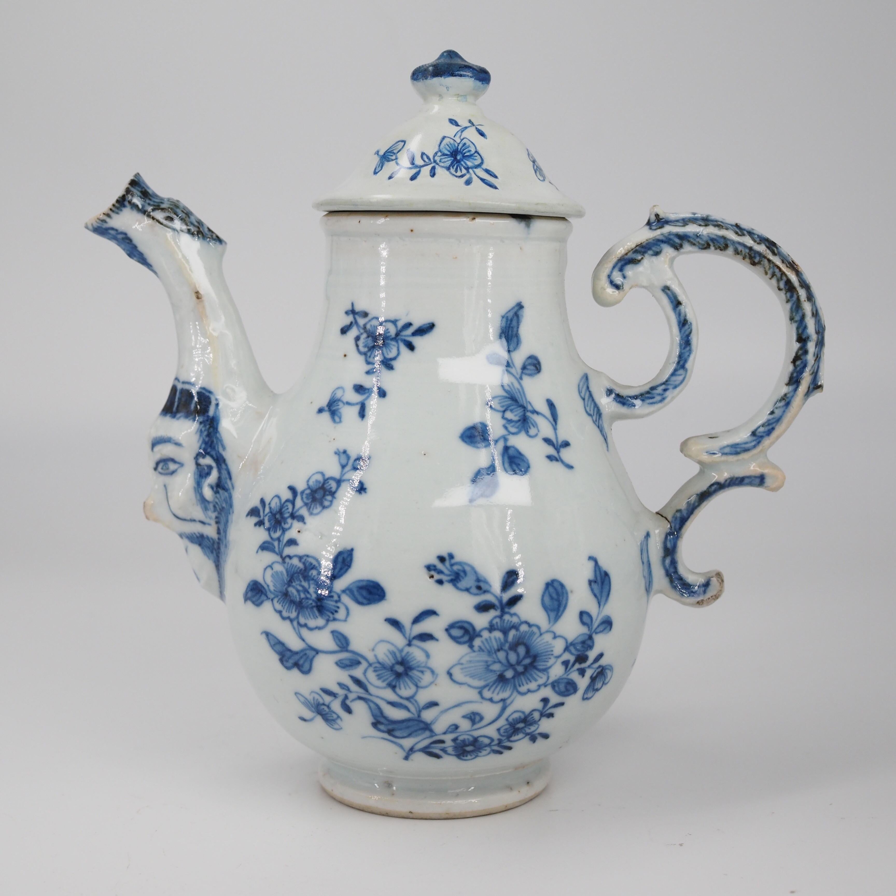 Rare Chinese export ewer, copied from a Meissen original of circa 1740, the baluster shaped body on short base, with c-scroll handle and birds-head moulded spout, a face moulded at the join with the body, painted in underglaze blue with scattered