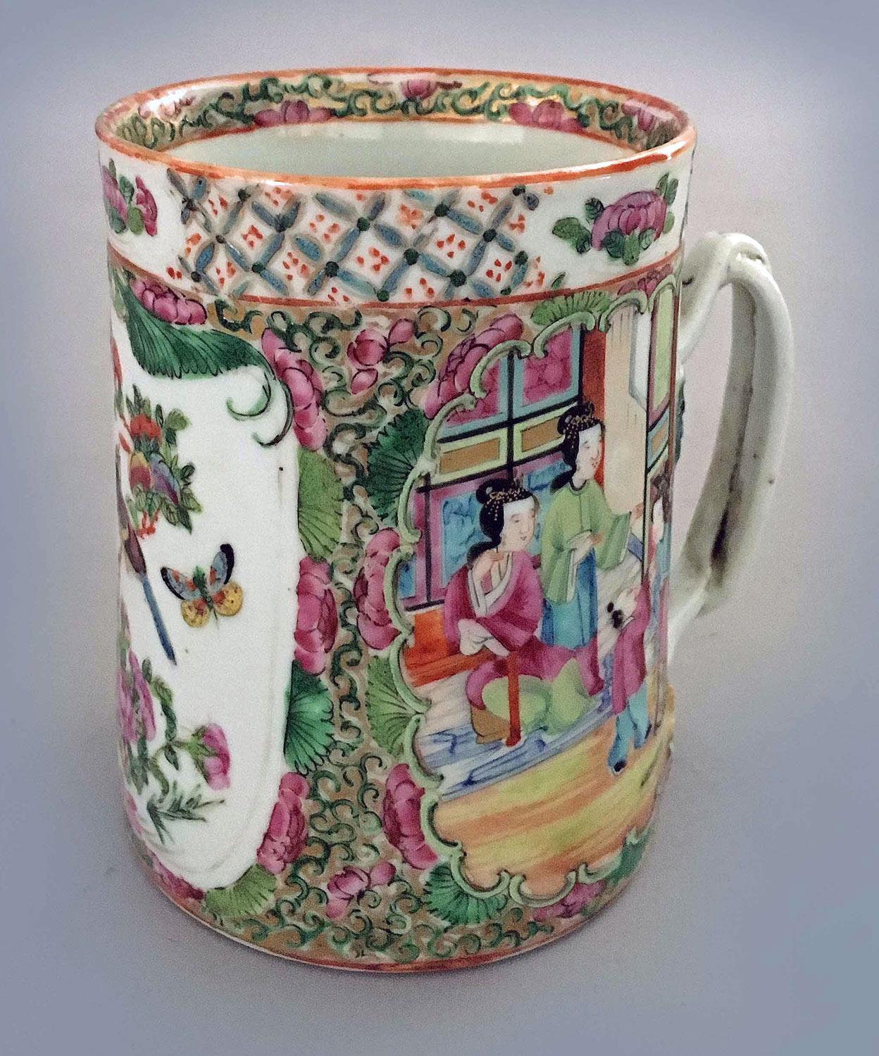 Antique Chinese Export famille rose medallion mug with a partially gilded double-twist handle, decorated with three panels, two of which are palace scenes of women with their children. The third panel encloses a bird perched on a branch with