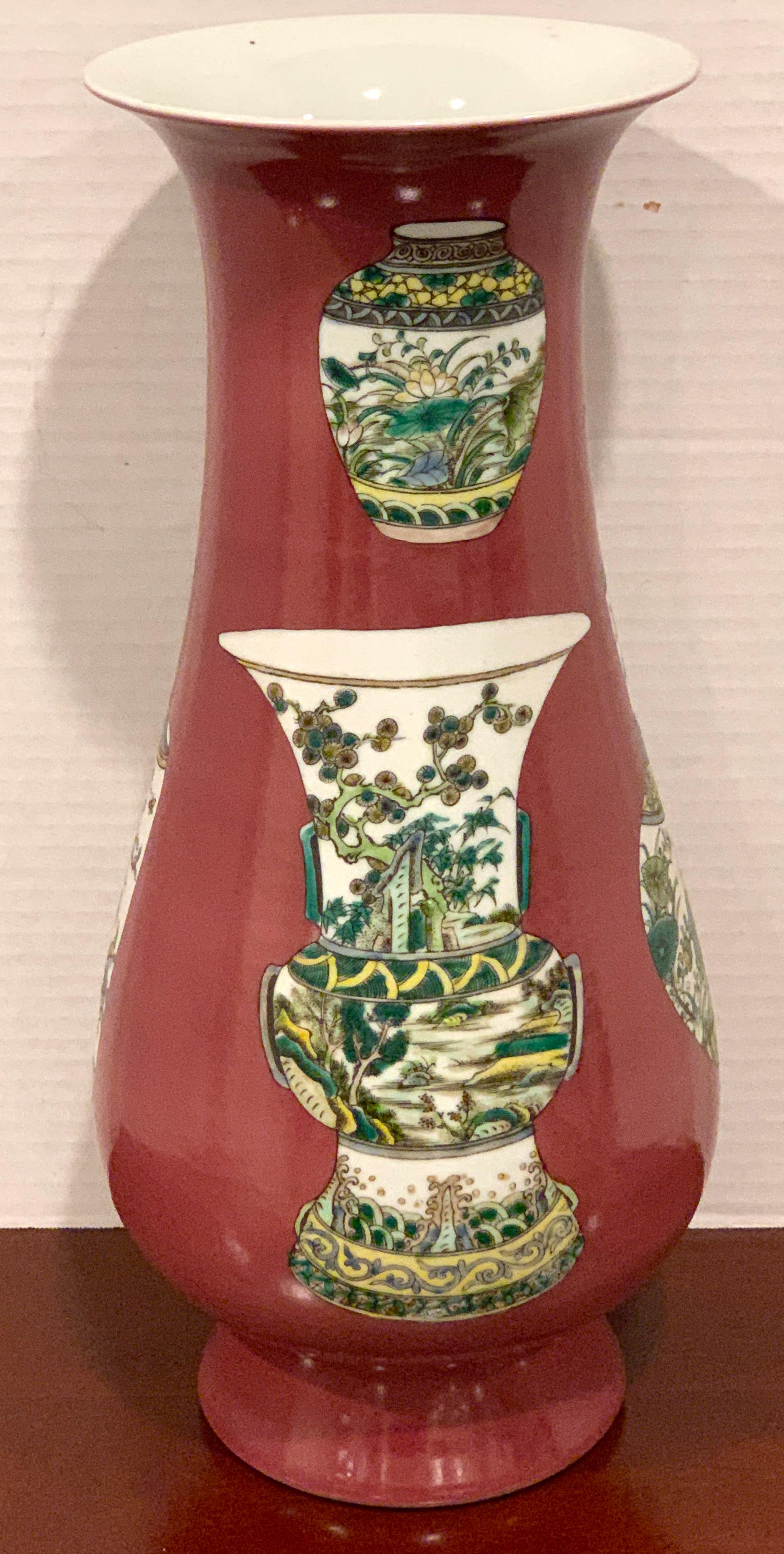 Chinese Export Famille rose plum background Chinese vase motif vase, decorated with various Chinese vases, with honorary reign mark in blue underglaze. Measures: 17