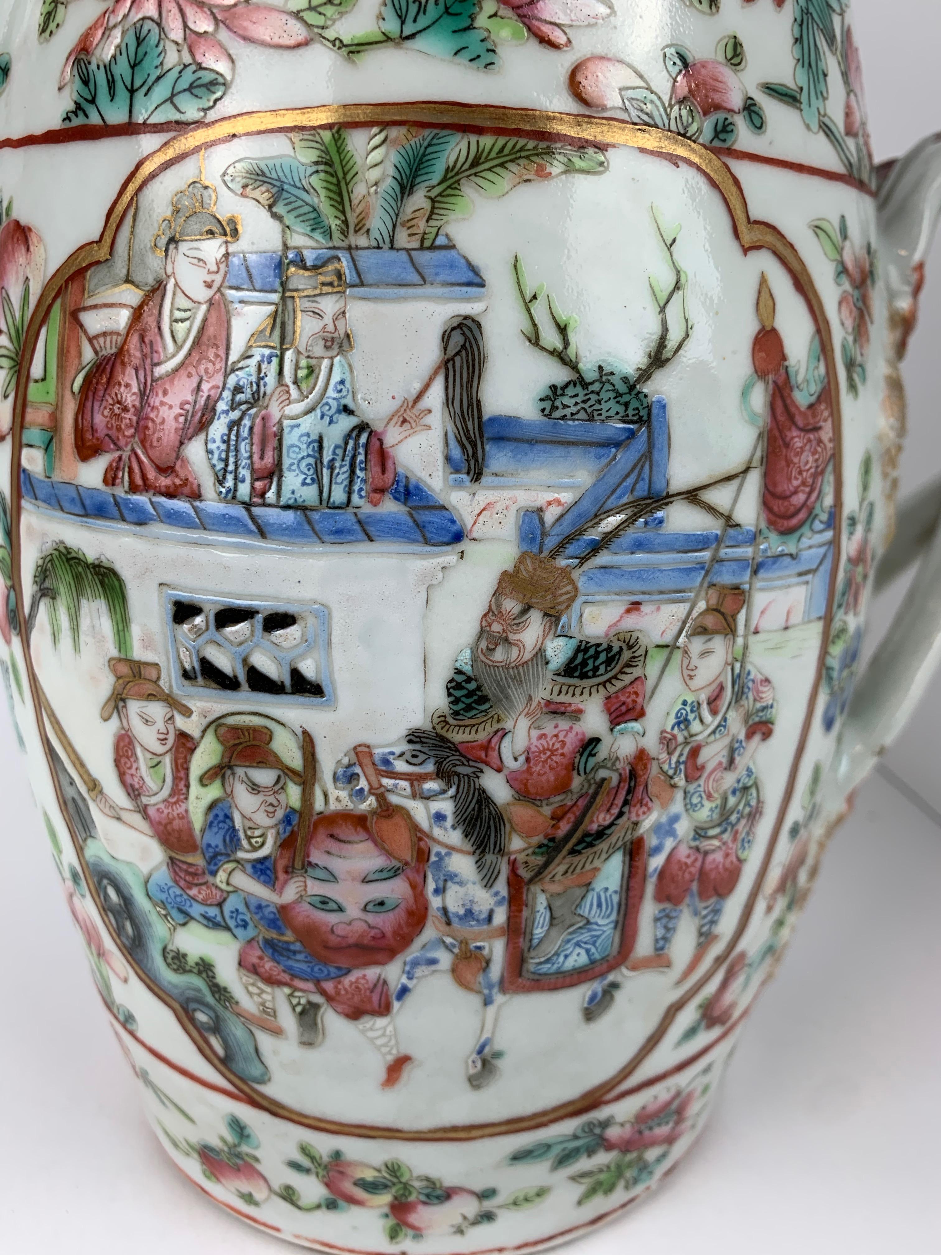 Chinese Export Rose Canton Mandarin pattern porcelain cider jug with double or cross strap handles. There are court scenes in the most colorful hues. The borders are filled with fruits and flowers. The lid is shaped like a coolies hat with a small