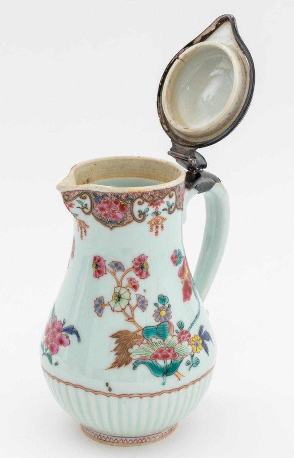 Chinese Export Famille Rose Porcelain Silver Mounted Ewer, circa 1760, with floral decoration and gilt embellishments. Silver tested. 7.75