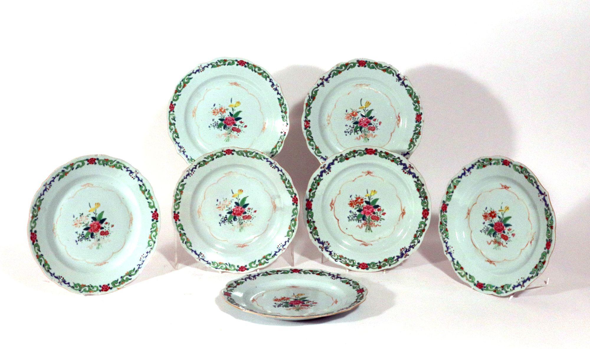 Chinese Export Famille Rose Porcelain Plates with Green Enamel, 
Set of Twelve,
Circa 1775

The Chinese Export porcelain plates had a wavy shaped rim which is decorated with a continuous leaf and flower scroll band in green enamel and famille rose. 