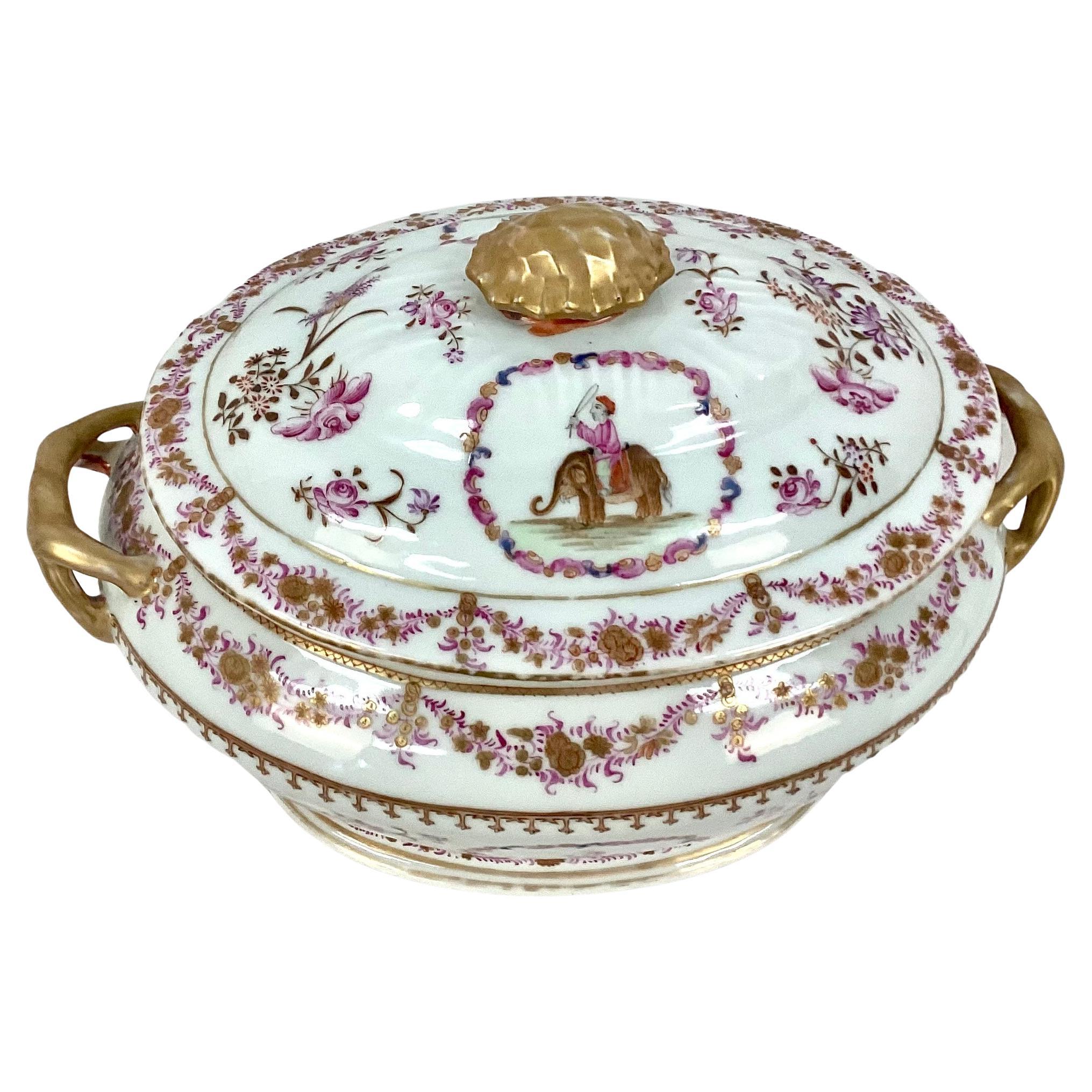 Chinese Export Famille rose porcelain soup tureen and underplate. Qianlong Period, decorated with the figure of a mahout astride an elephant and flower sprays with gold rim. The theme of this lot indicates that it was probably made for the European