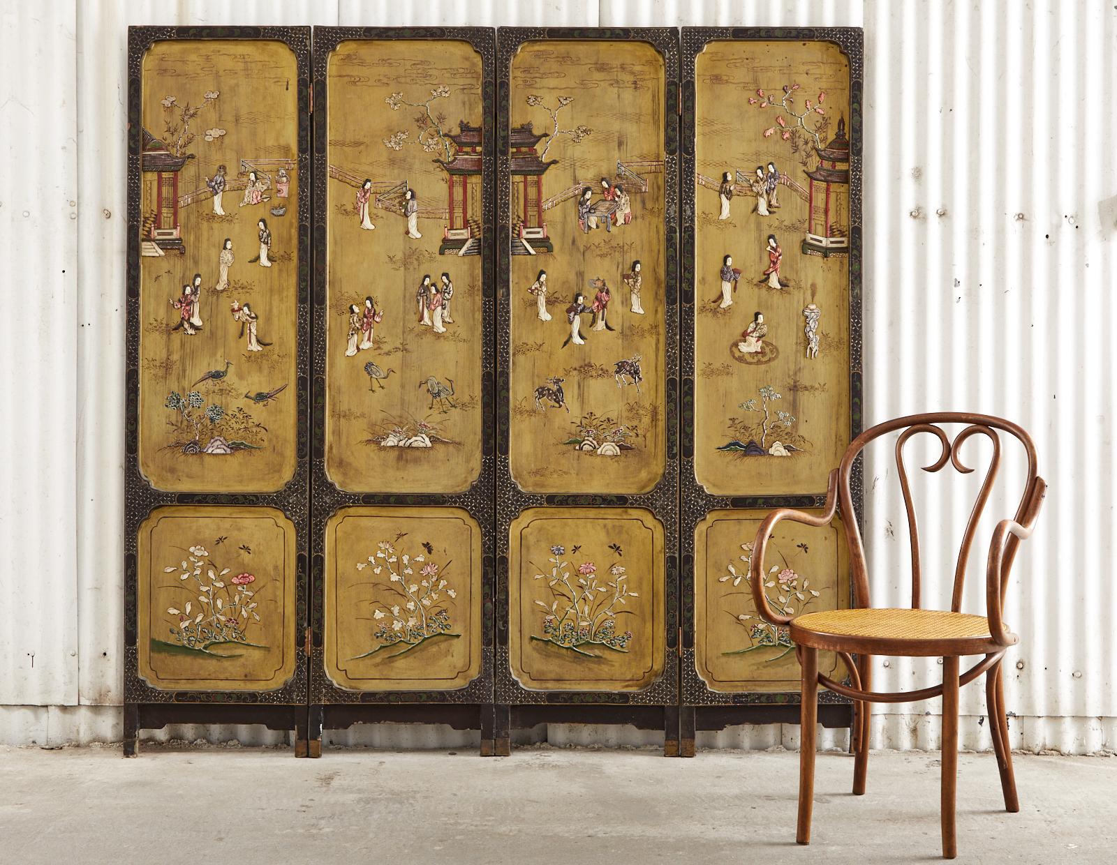 Extraordinary Chinese export four-panel coromandel screen from late Qing dynasty featuring a carved soapstone and wood pagoda landscape. The lacquered panels are decorated with carved beauties among flora and fauna over a gilt background. The screen