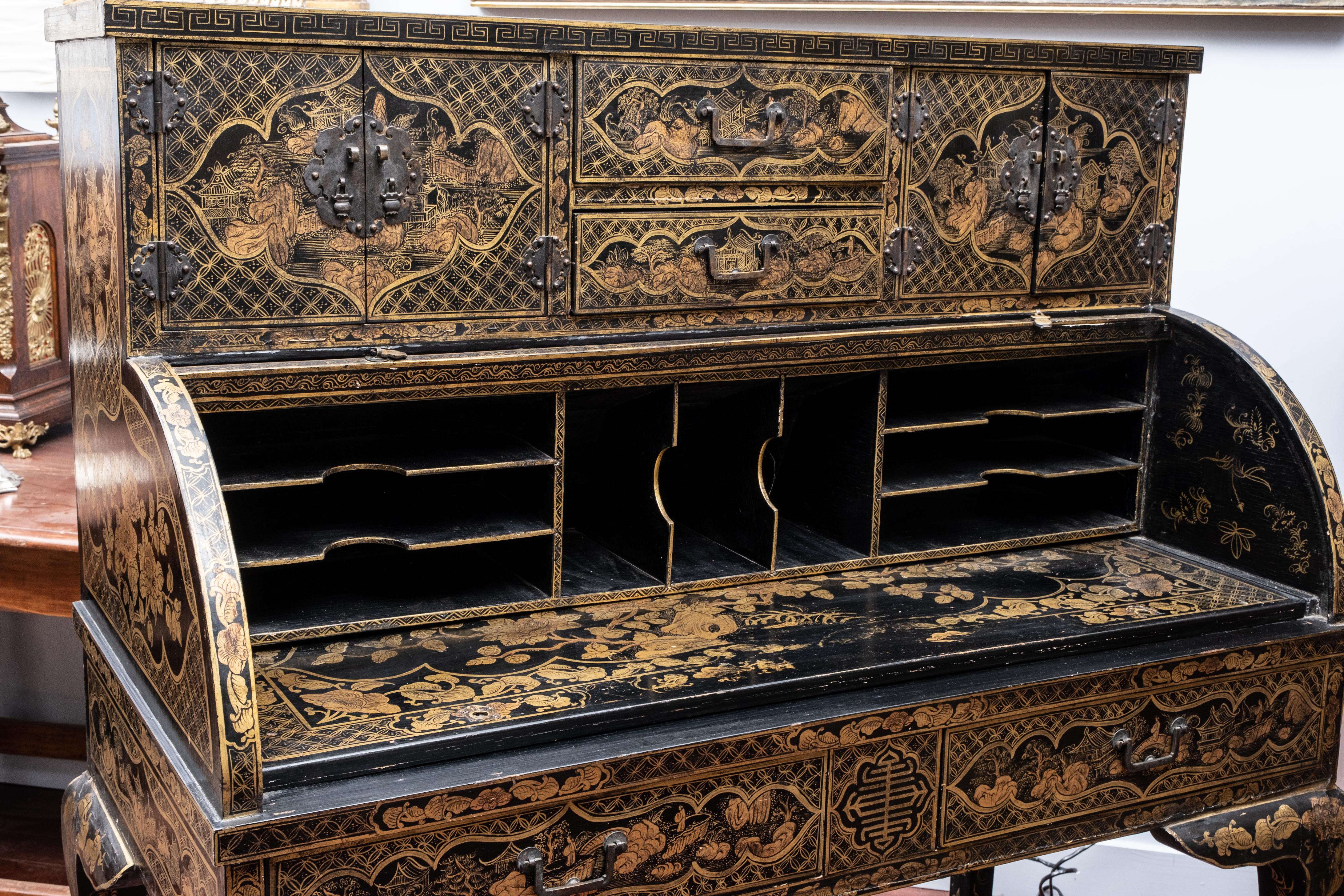 Chinese export gilt black lacquer desk with a cylinder roll top supported on cabriole legs together with a related lacquer chair. The desk is hand painted with calligraphy and images. the translation of the calligraphy seemingly relates to the