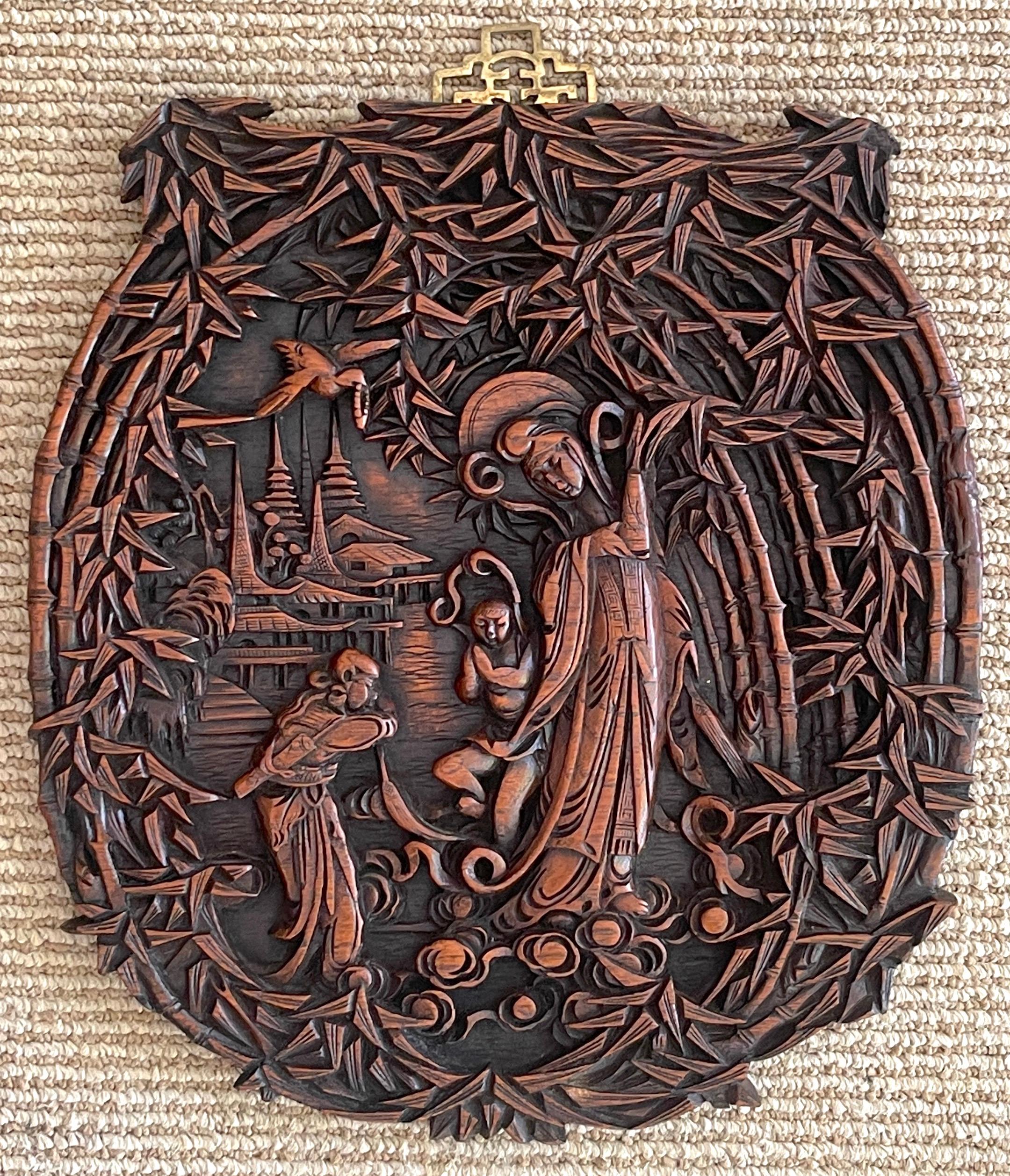 Chinese Export Hardwood Carved Plaque of Quan Yin in Landscape 
China, circa 1920s

Expertly hand carved landscape plaque of Quan Yin the Buddhist goddess of compassion, mercy, and healing and the eternal protector of women and children. Mounted