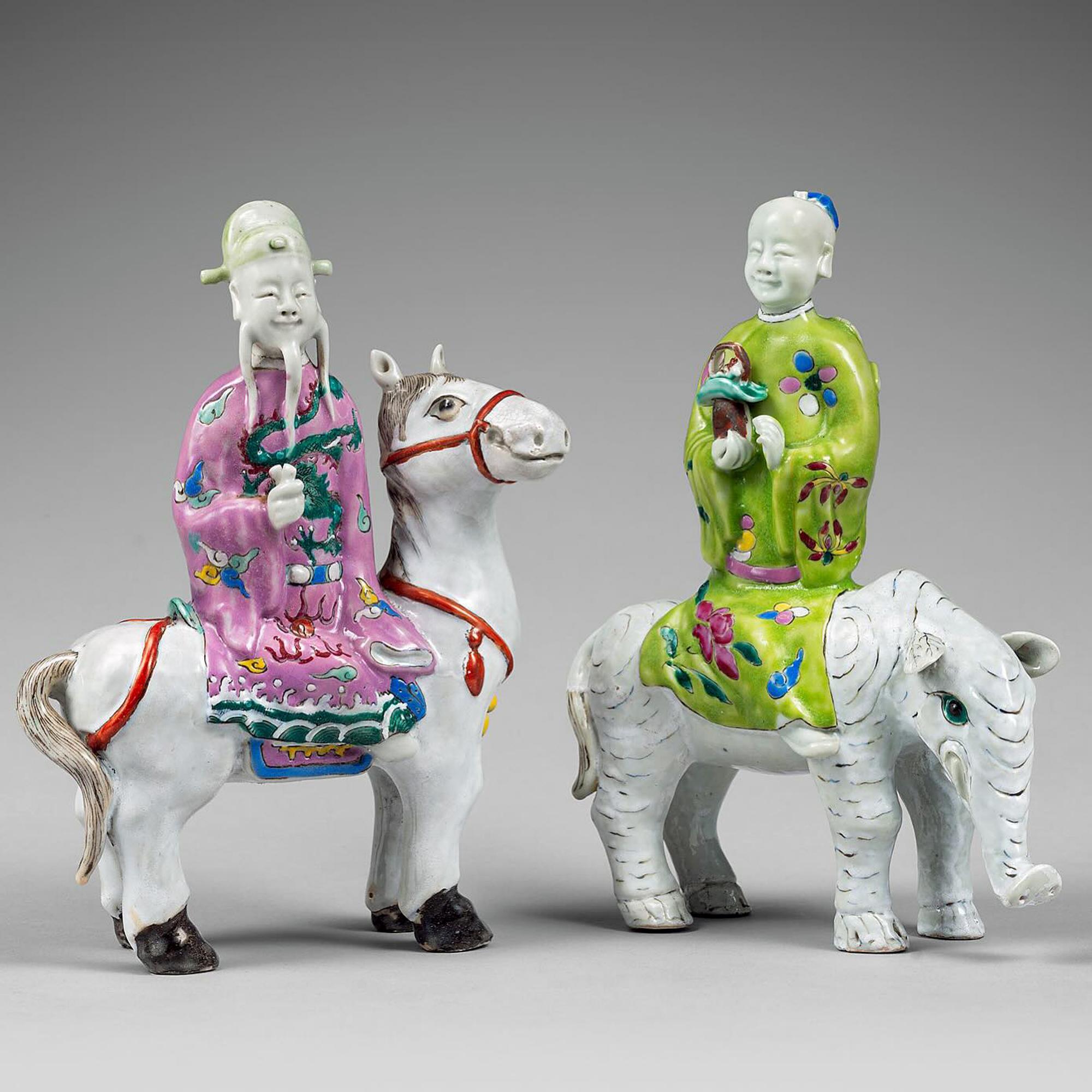 Chinese Export Porcelain Immortal Figures Mounted on the Back of Animals,
Circa 1780

The rare Chinese Export porcelain figures depict two immortals riding on the backs of a mythical elephant and a horse. Cao Guojiu with castanets on a white horse,