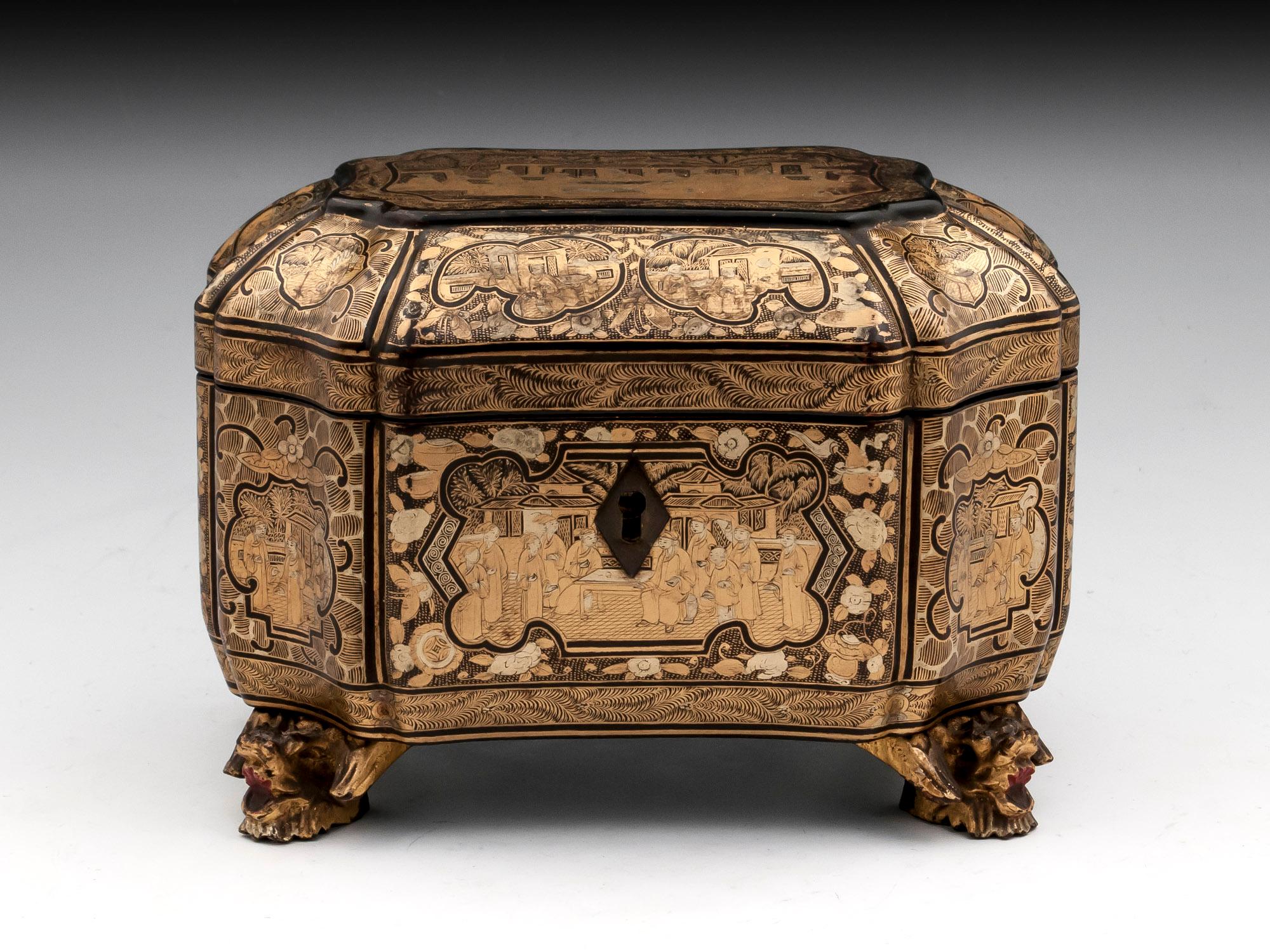 Small Chinese export lacquer tea caddy standing on four dragon feet. Each side is adorned with exquisitely detailed chinoiserie scenes.

Has fully working lock and tasseled key.
 