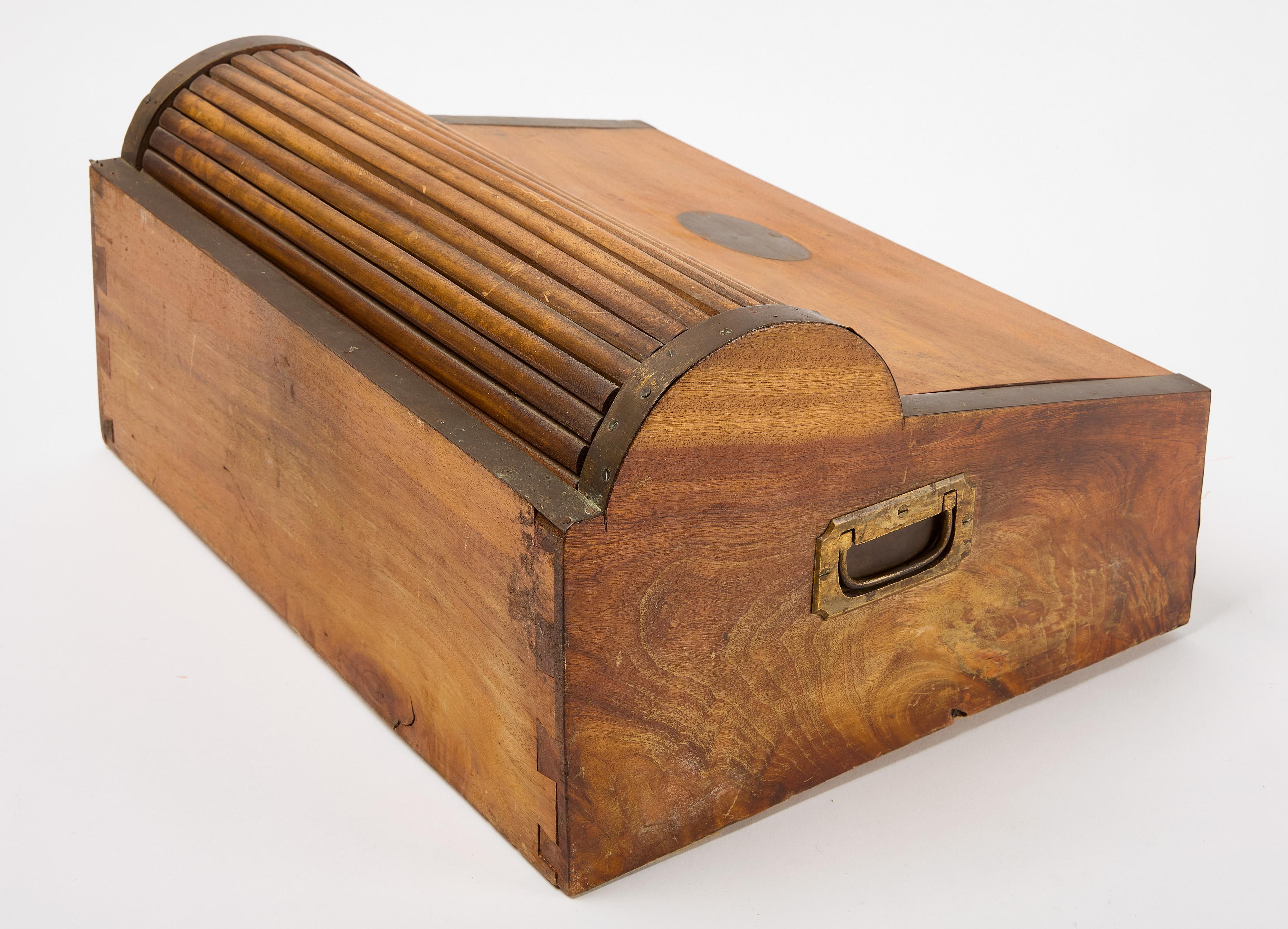 Roll-top lap desk. Dovetailed construction and brass bound case. Chinese export, circa 1830.

H 8-3/4