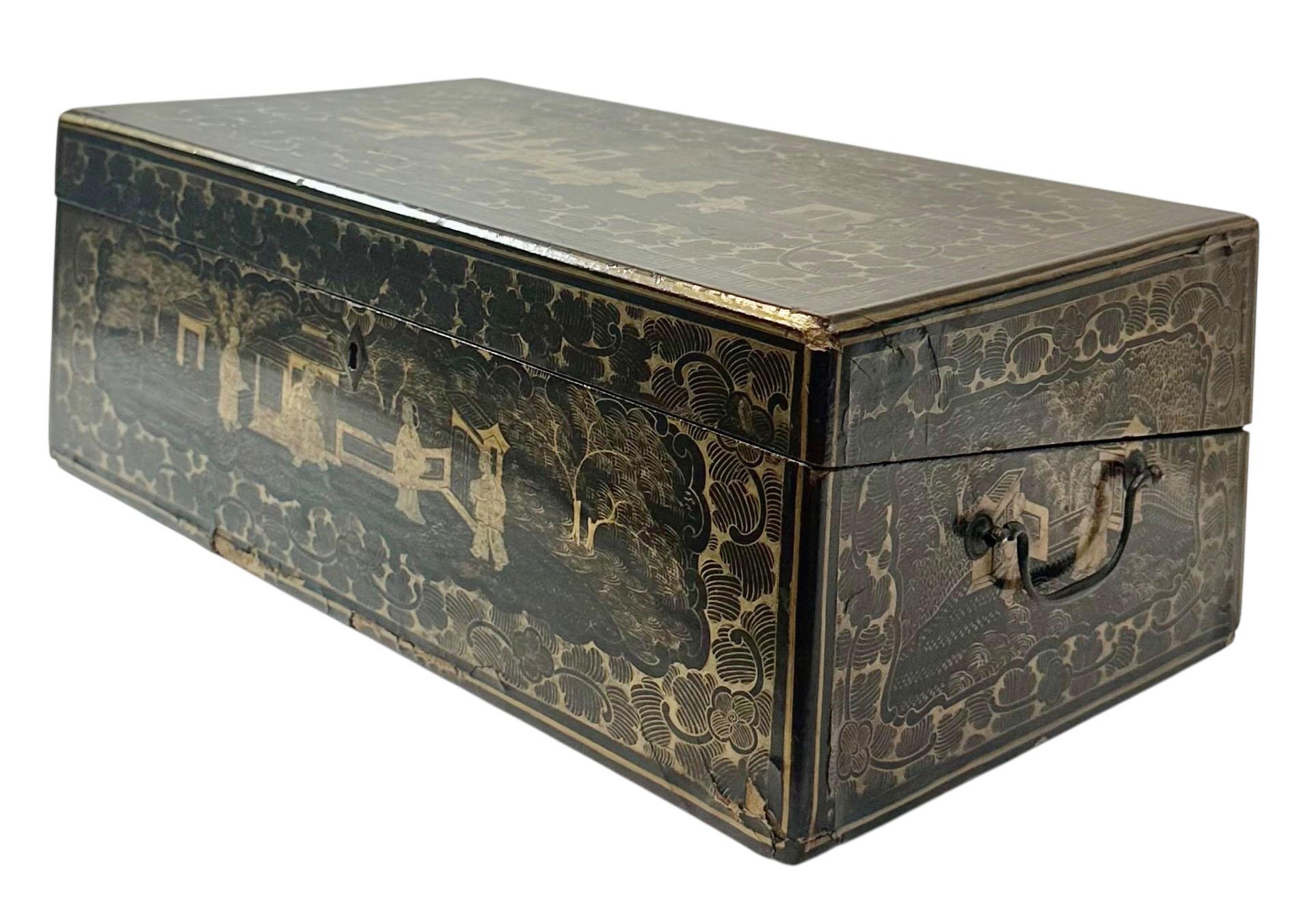 A beautifully preserved early 1800s Chinese export lap desk, crafted with fine attention to both utility and elegance. The slanted surface features its original embossed leather writing surface, framed by rich wood with a warm, time softened patina