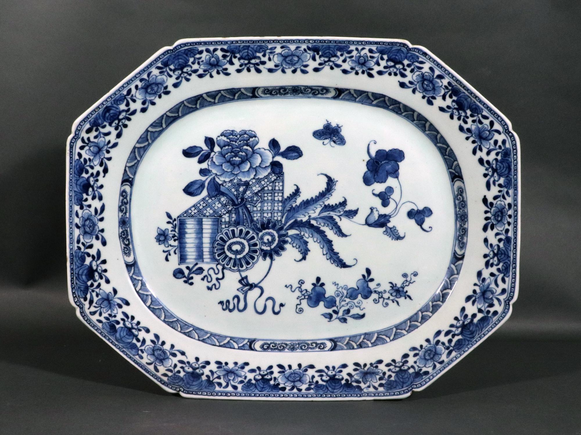 Chinese Export Large Underglaze Blue & White Porcelain Dish,
Circa 1770

The large attractive Chinese Export Blue and White Porcelain dish is unusually painted with a rare design.  The design is slightly off center with several fabric-covered