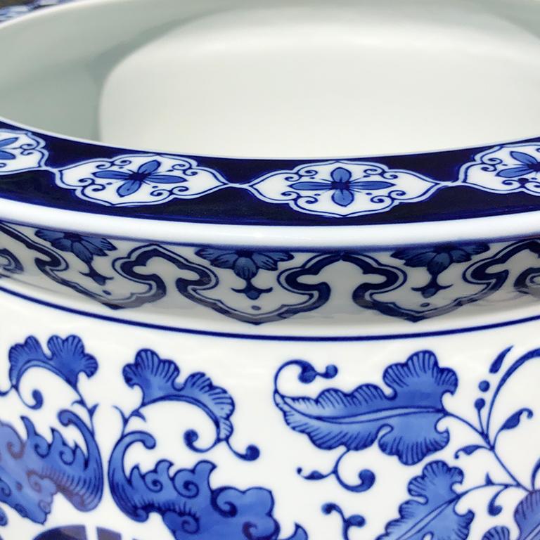Chinese export ceramic long life or longevity fish bowl planter in blue and white with floral design. The front features a Long Life character on the front surrounded by intricate blue floral glaze. For those that lack a green thumb, this might be a