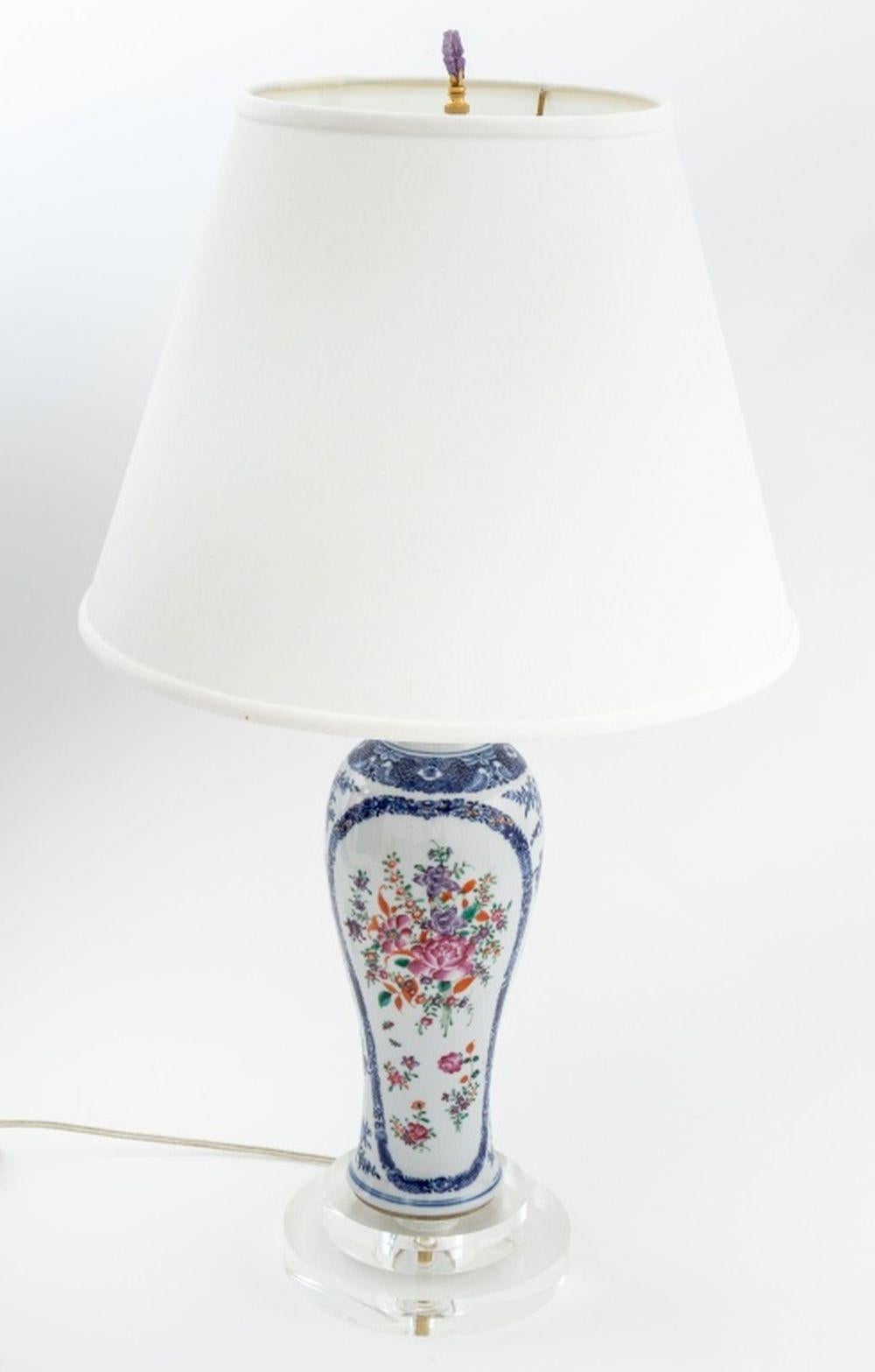 Chinese Export Elongated Meiping Porcelain Vase Mounted as a Table Lamp, with blue and white underglaze and famille rose overglaze floral decoration, atop a stepped clear acrylic base with white linen shade. Overall: 29.5