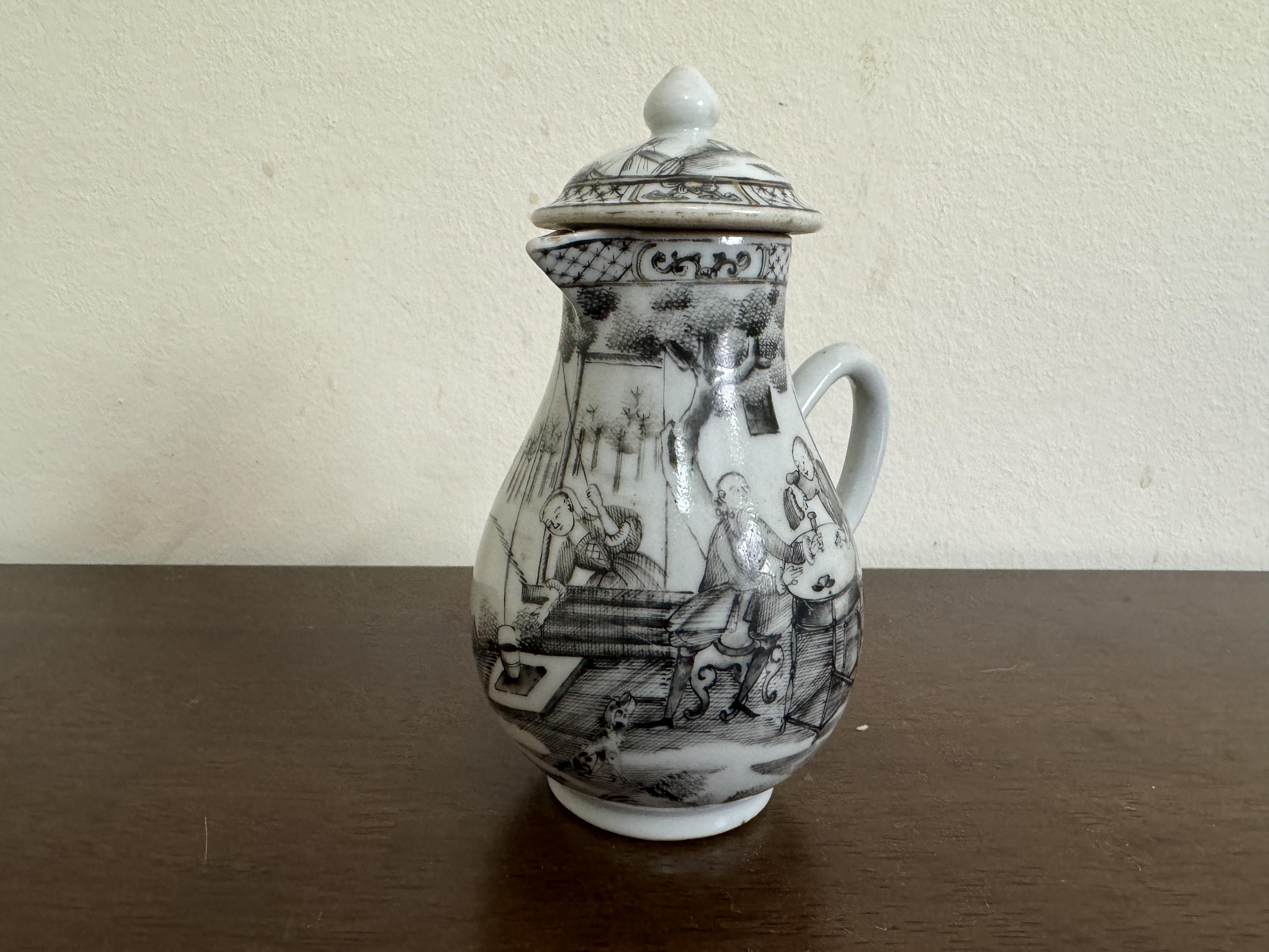 Chinese export Milk jug and Lid, from the 18th century Qianlong era featuring hand-painted grisaille designs, circa 1760. 

The jug rests on a foot ring, with a pear shaped body and handle, and a small triangular spout at the rim. The C-shaped