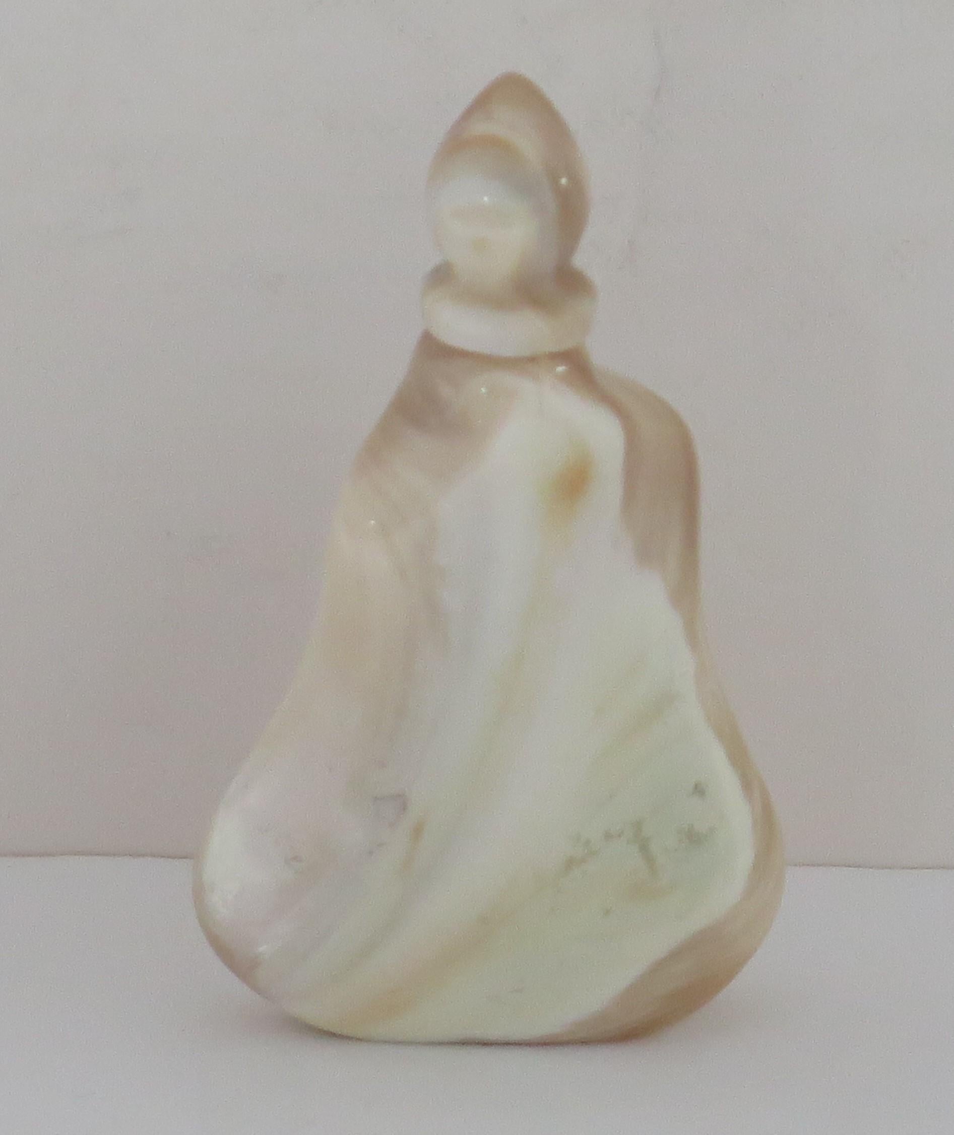 This is a very beautiful Chinese Export snuff bottle with a rare hand carved shape, complete with its matching top and made from natural agate stone, having lovely veined colors, which we date to the mid 20th century, Circa 1940.

The bottle has a