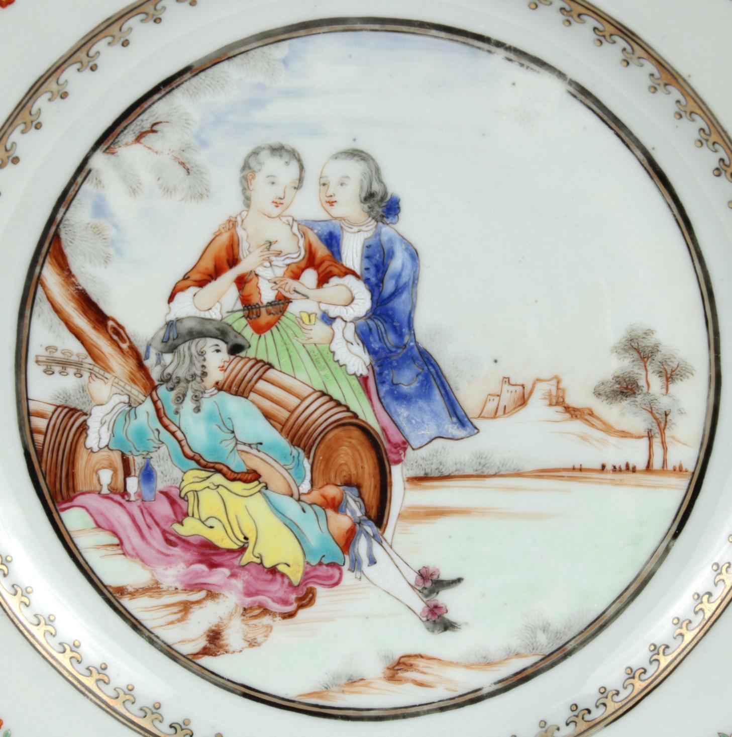 Chinese Export porcelain plate, the center painted with a troubadour playing a lute and reclining near a decanter and two glasses amidst two barrels, while a gentleman caresses a woman playing the triangle; the elaborate border painted with brightly