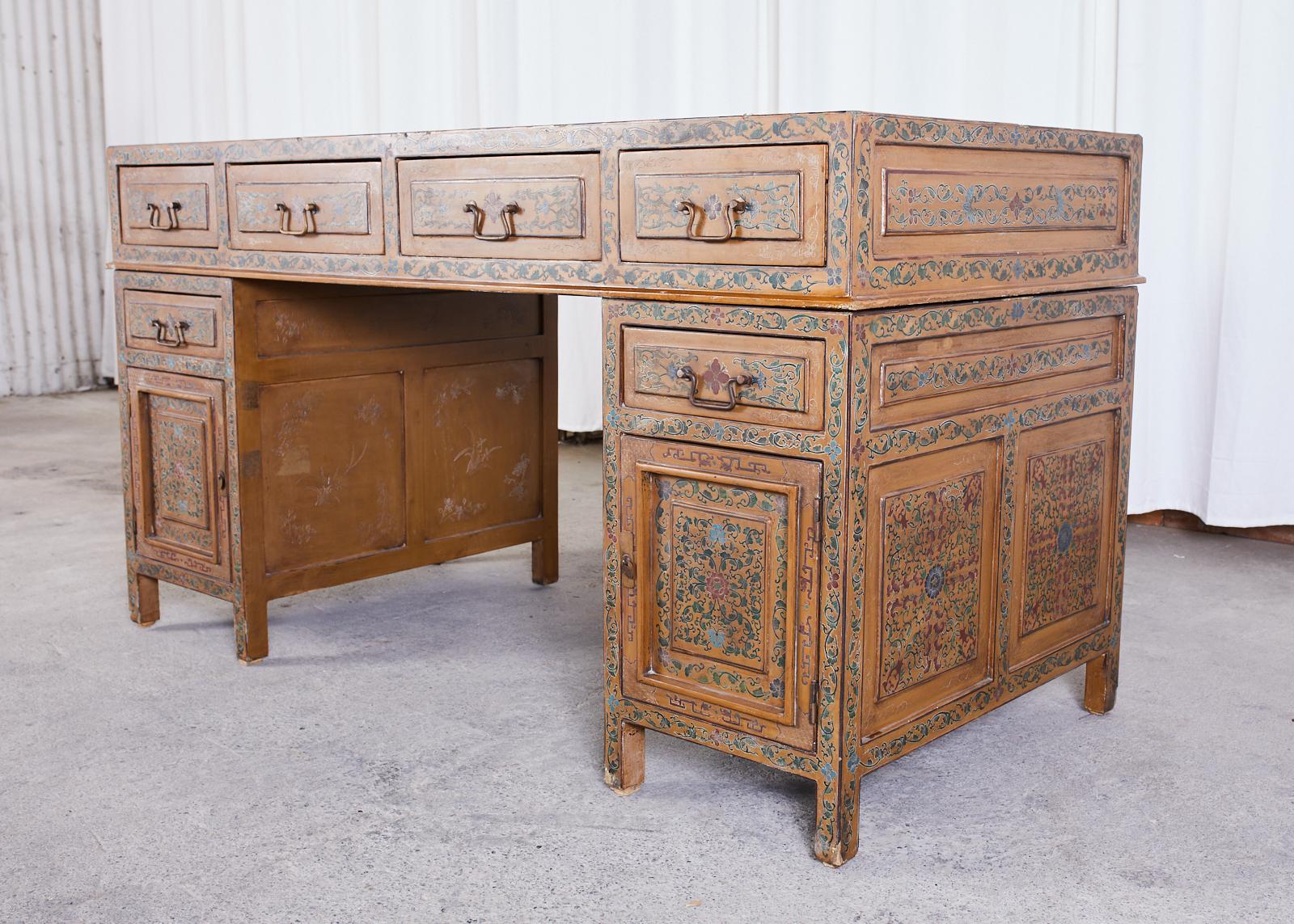 Exquisite Chinese export pedestal three-part desk or writing table featuring a beautifully polychromed finished case. The top of the desk has four storage drawers and fits on top of two pedestals each having a storage drawer above a door with open