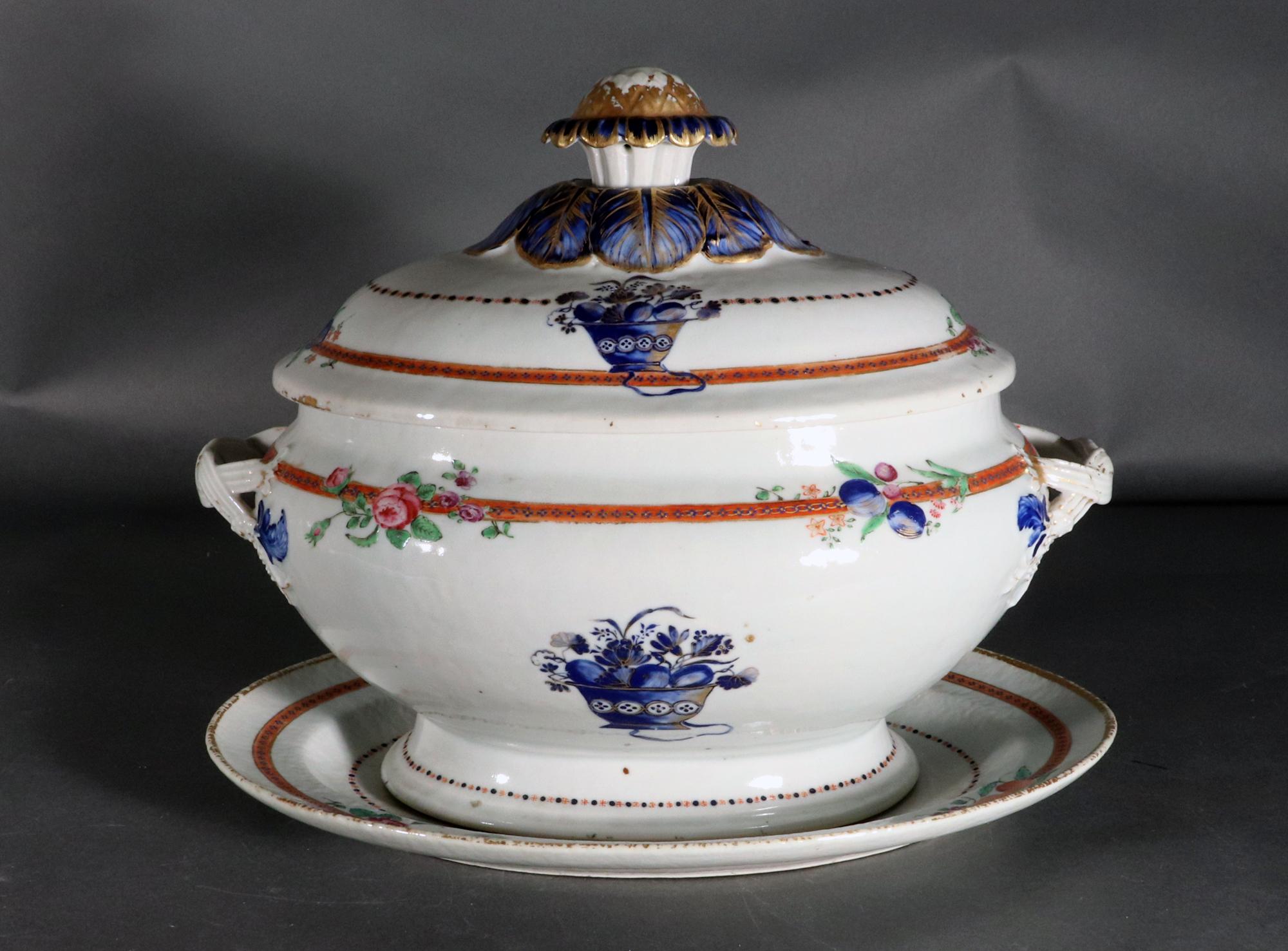 Chinese Export Porcelain American Market Soup Tureen and Cover and Stand,
Circa 1780.

The Chinese Export porcelain bombe-form soup tureen, cover and stand is painted with blue enamel and gold baskets to front and back on the tureen and the cover. 