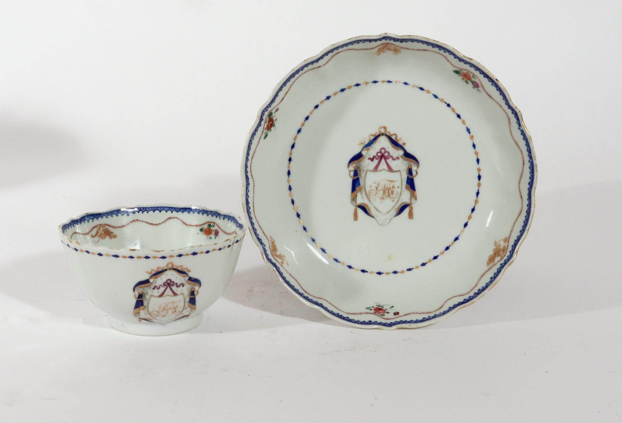 Chinese Export Porcelain Armorial Tea Bowl & Saucer
Initials MJ,
American Market,
Circa 1785

The Chinese Export porcelain large tea bowl and saucer are painted in the center of the saucer with a gold and underglaze blue design with a hanging shield
