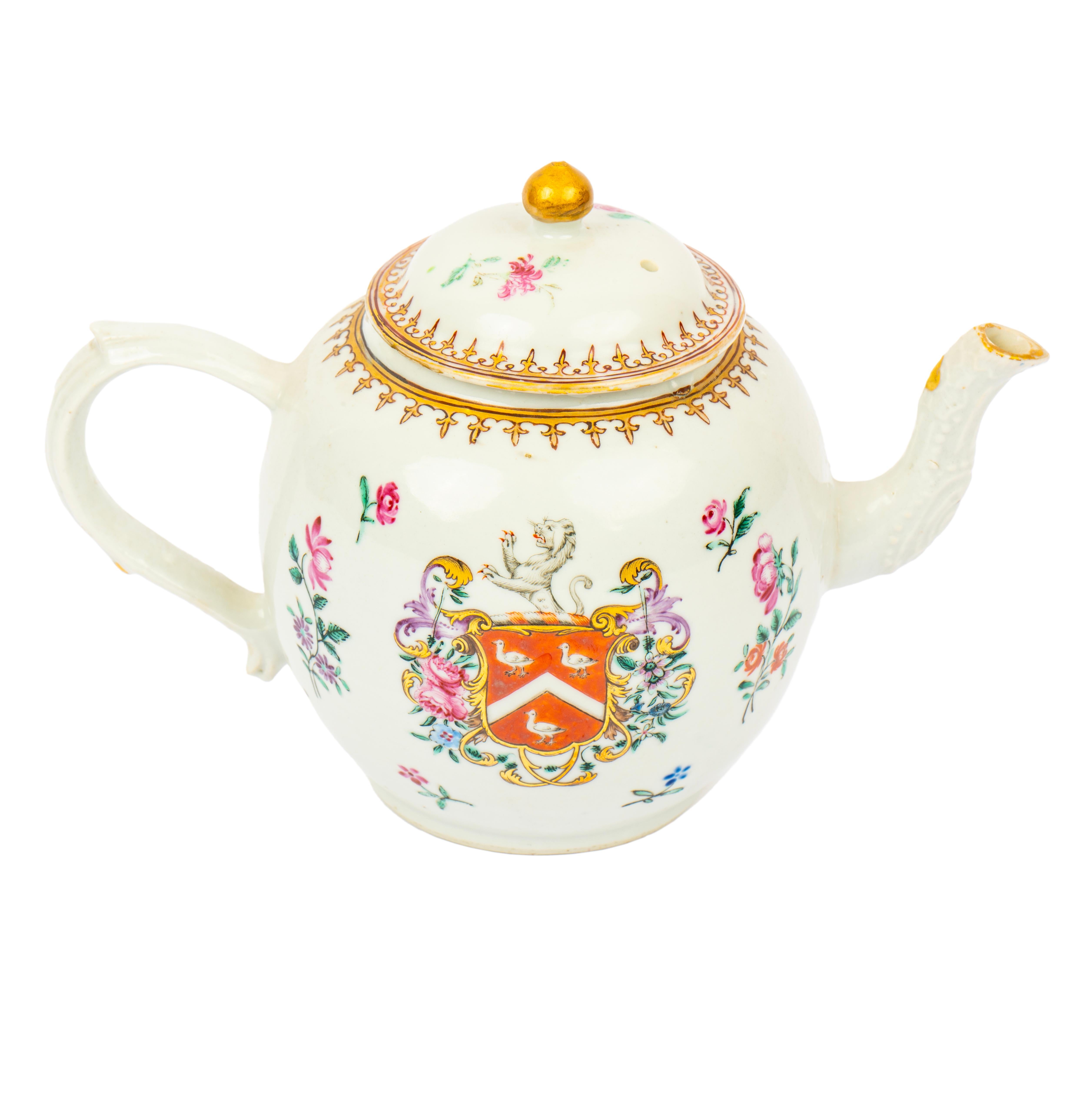 This beautiful Chinese armorial porcelain teapot bears the Arms of Sayer. The bulbous body with reeded C-scroll handle and foliate impressed spout, below domed cover, decorated with sprigs of blooms in hues of pink, mauve and green below gold-leaf