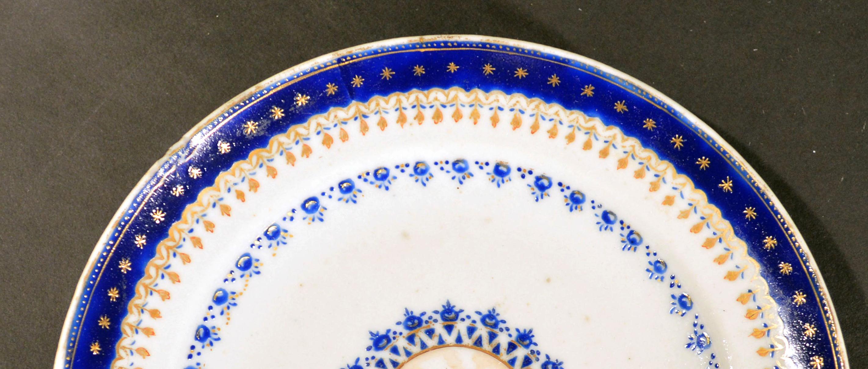 Chinese export Porcelain blue enamel plate made for the American Market, 
circa 1785.

The small Chinese Export American-market plate has a central roundel in brown depicting an, as yet group of unidentified large Federal-style buildings, in a