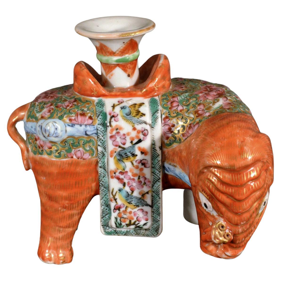 Chinese Export porcelain canton Famille rose elephant modeled as a candlestick, 
Circa 1860 

An upward-pointed elephant trunk is said to bring energy, luck, prosperity and kindness. The elephant raises its trunk to greet friends and express